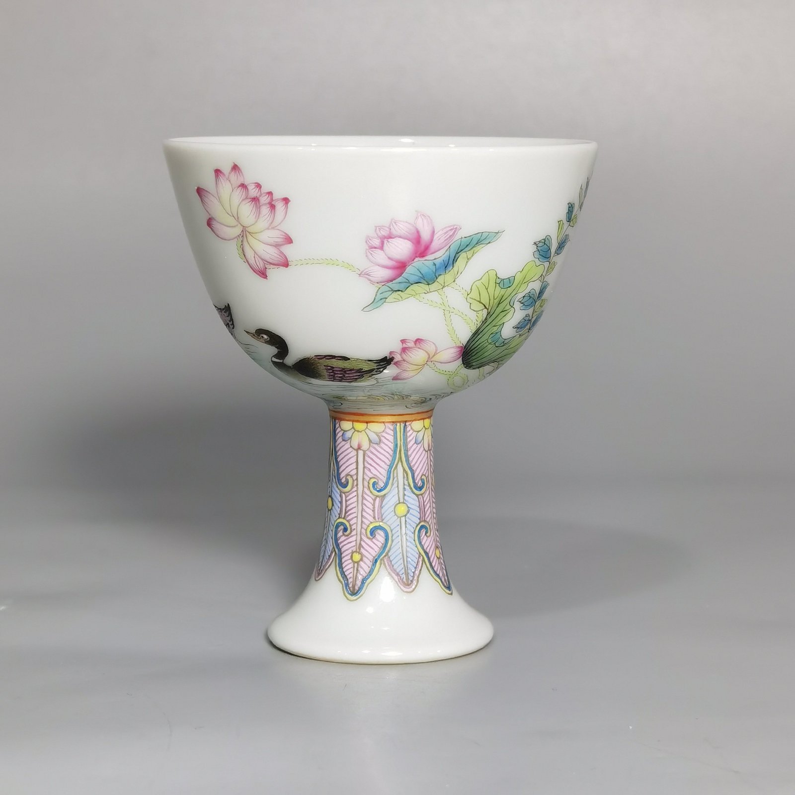 Qing Dynasty Yongzheng A pair of pastel mandarin duck and lotus goblets