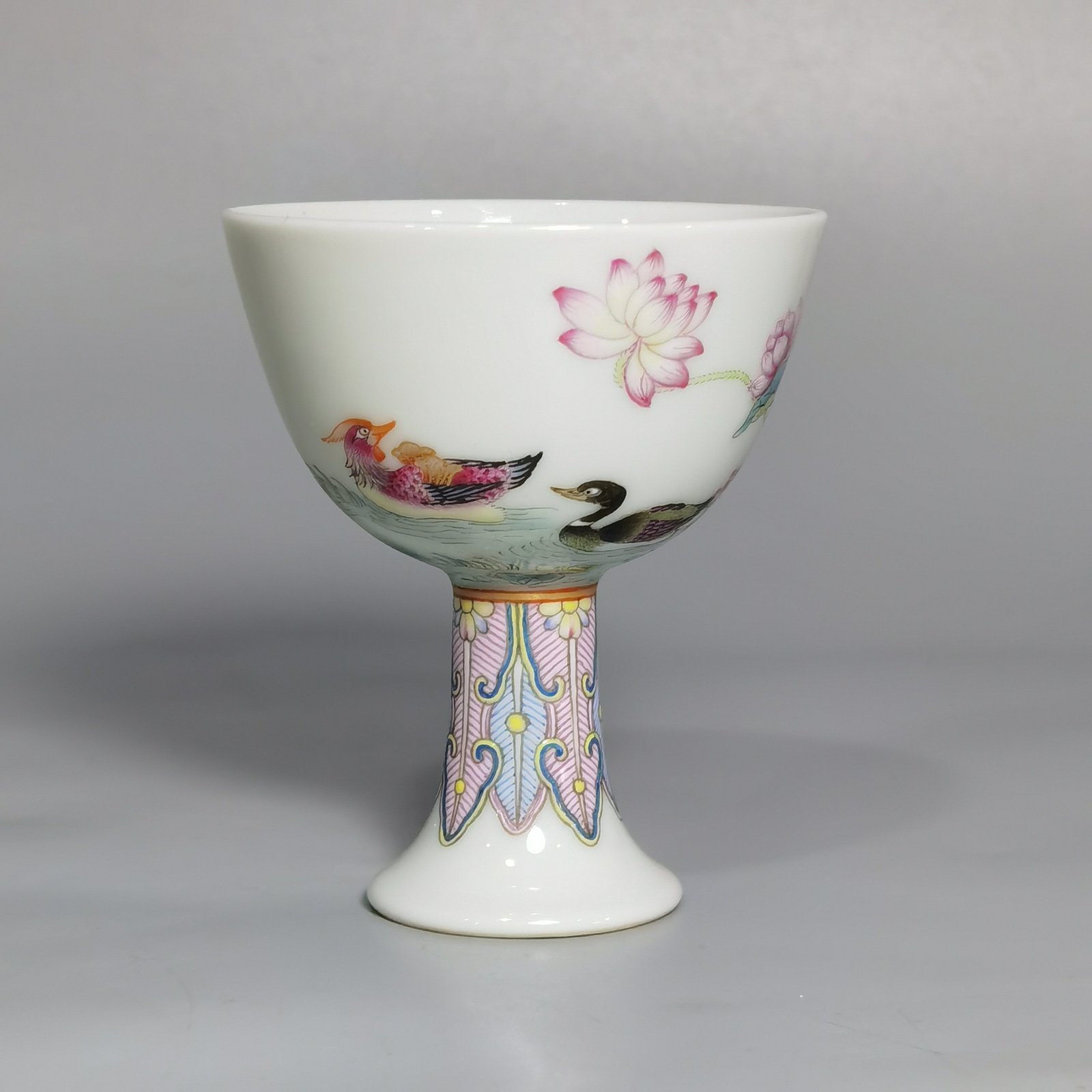 Qing Dynasty Yongzheng A pair of pastel mandarin duck and lotus goblets