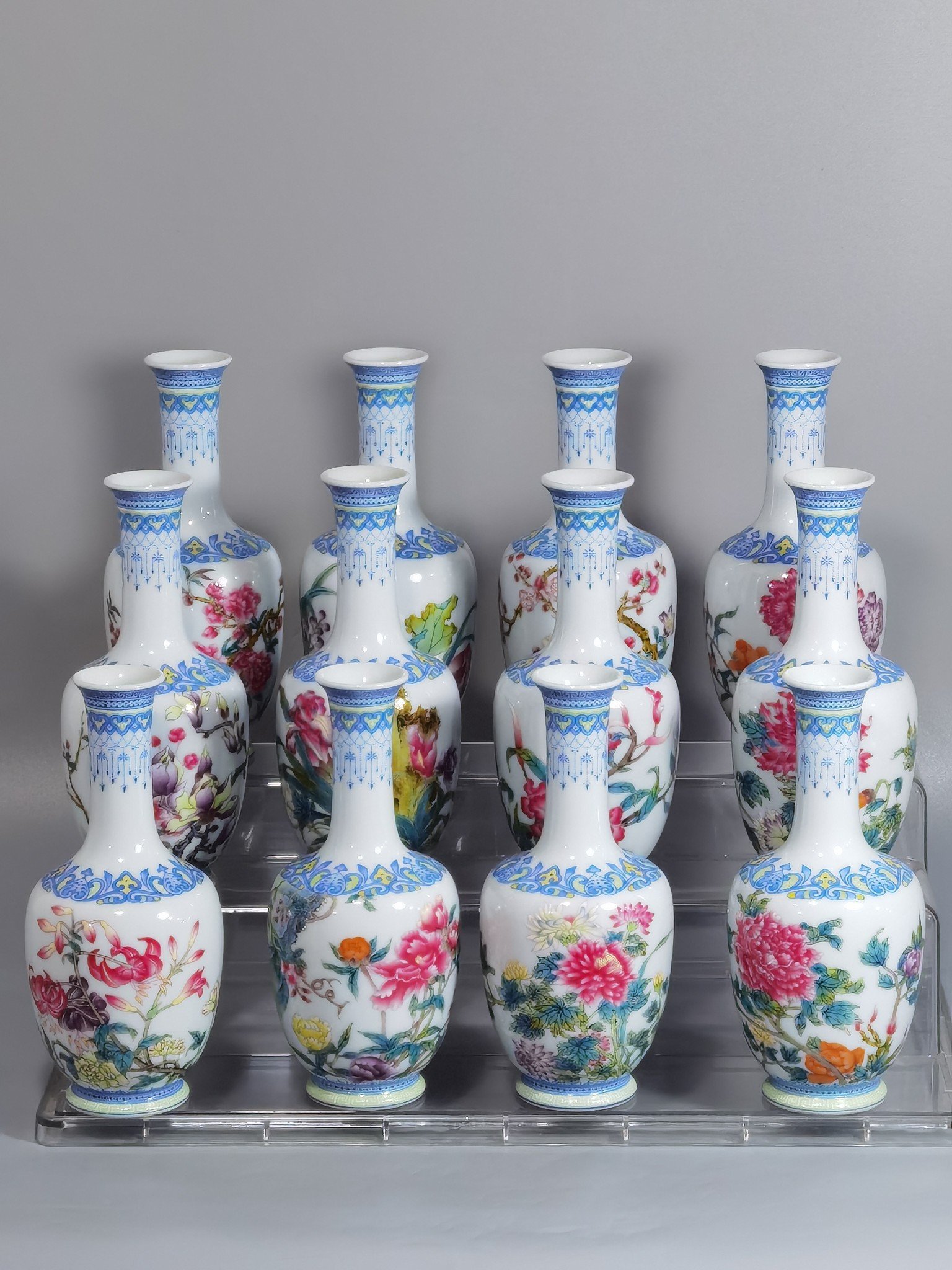 Qing Dynasty Yongzheng a set of enamel vases with twelve flower green edges