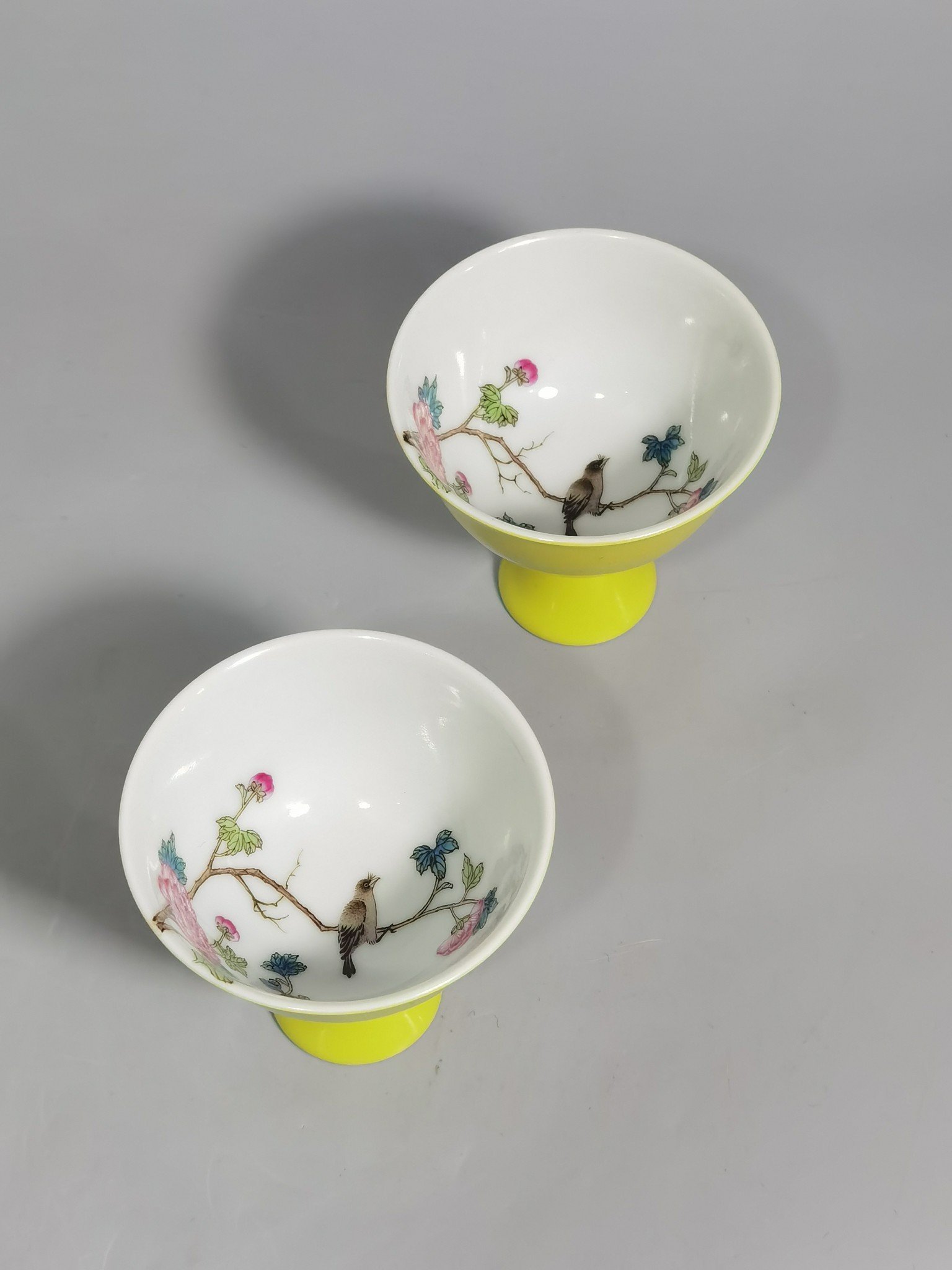 Qing Dynasty Yongzheng a pair of goblets with pastel flowers and birds