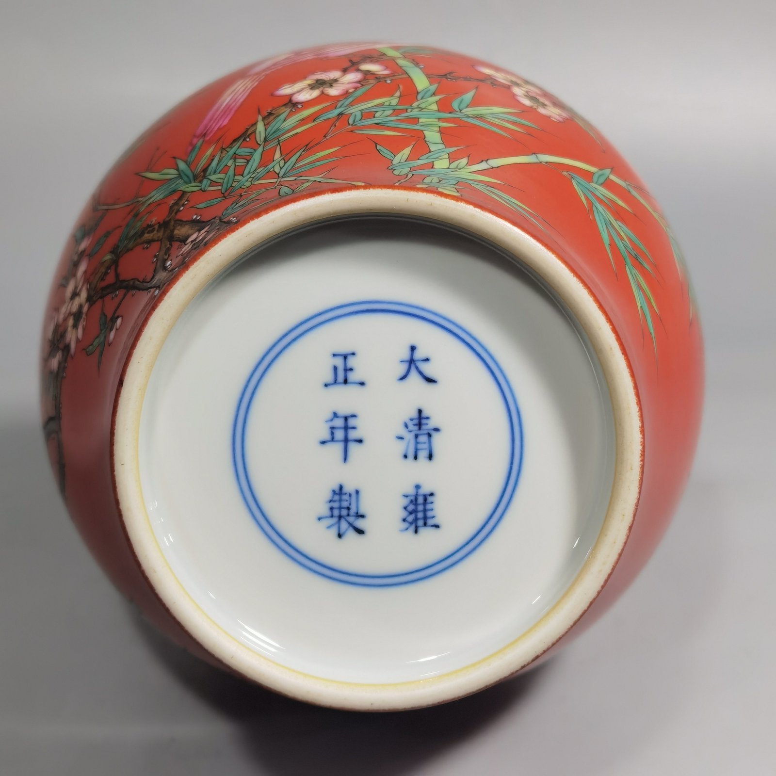 Qing Dynasty Yongzheng coral red ground pastel flower and bird garlic vase
