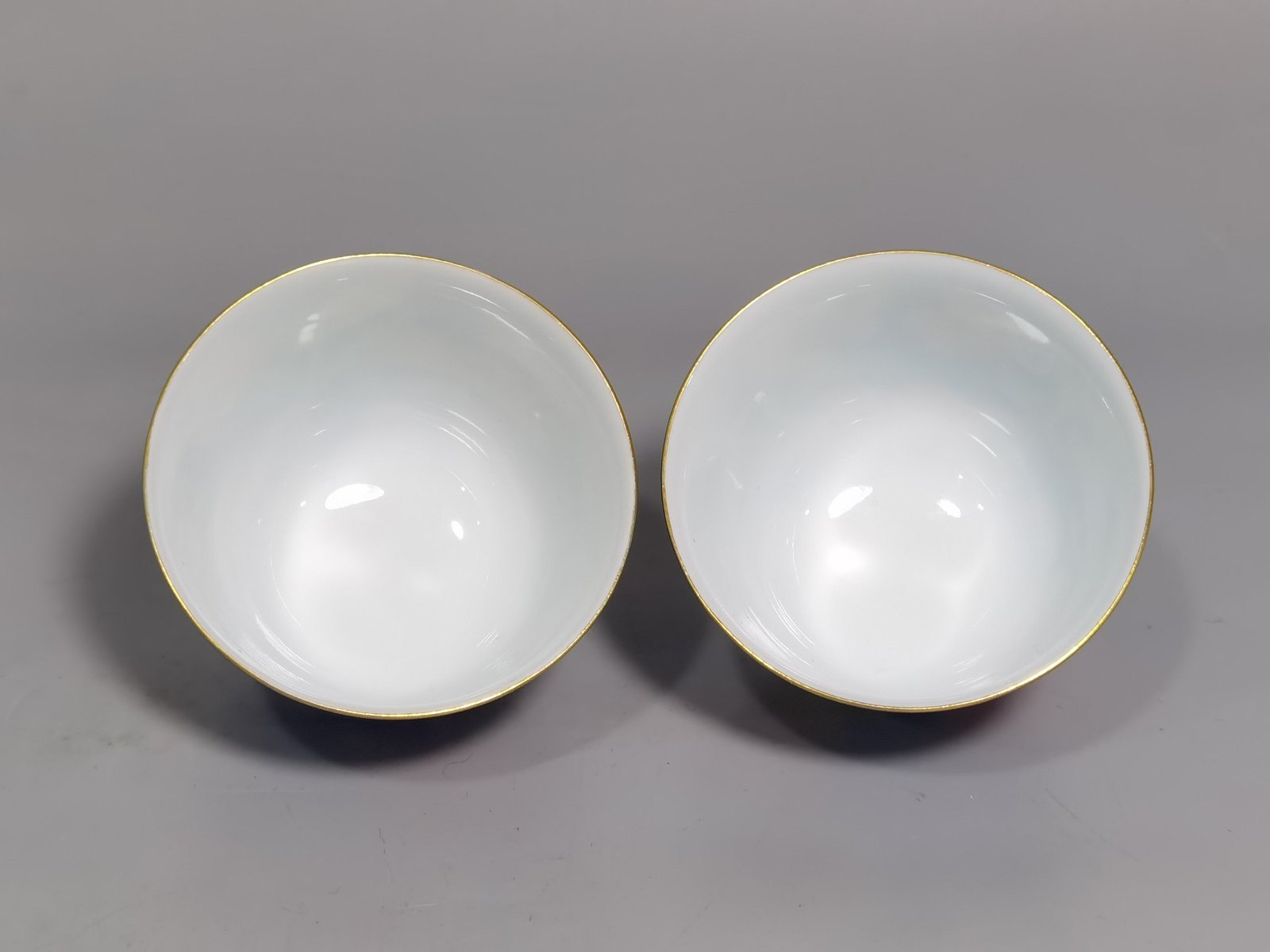 Qing Dynasty Yongzheng A pair of enamel sapphire and blue poppy cups