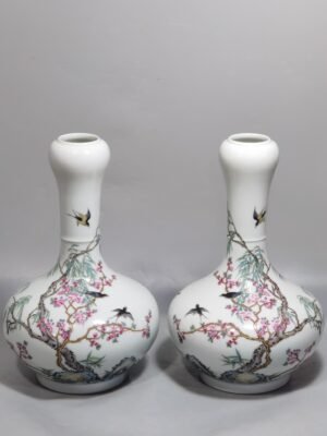 Qing Dynasty Yongzheng A pair of enamel garlic bottles with Spring Swallows pattern