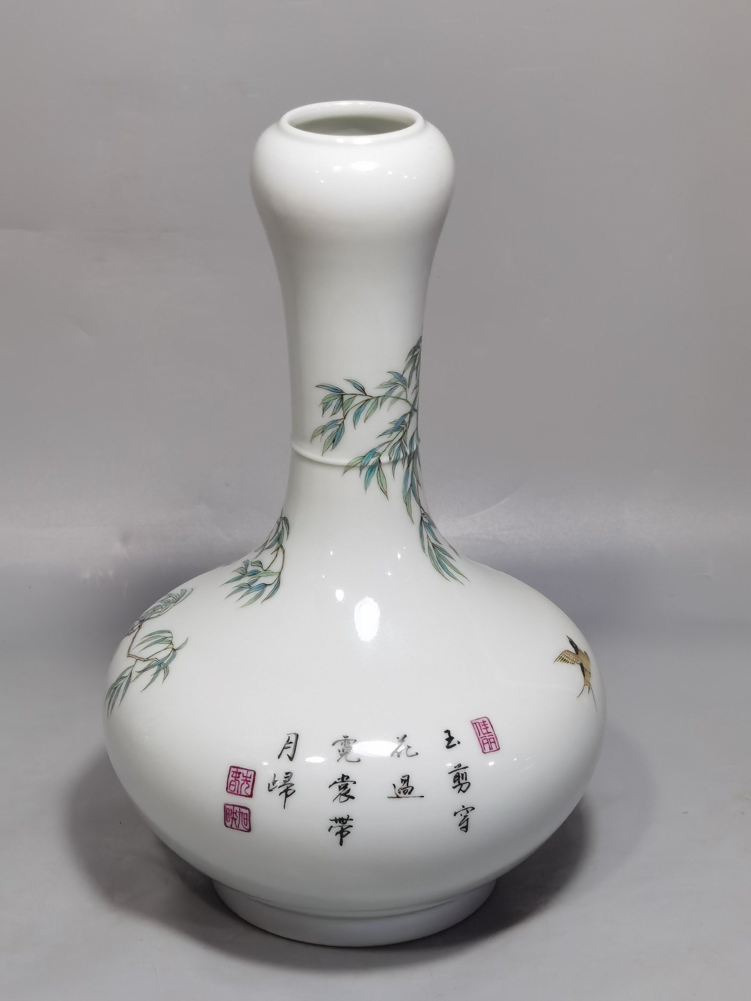 Qing Dynasty Yongzheng A pair of enamel garlic bottles with Spring Swallows pattern