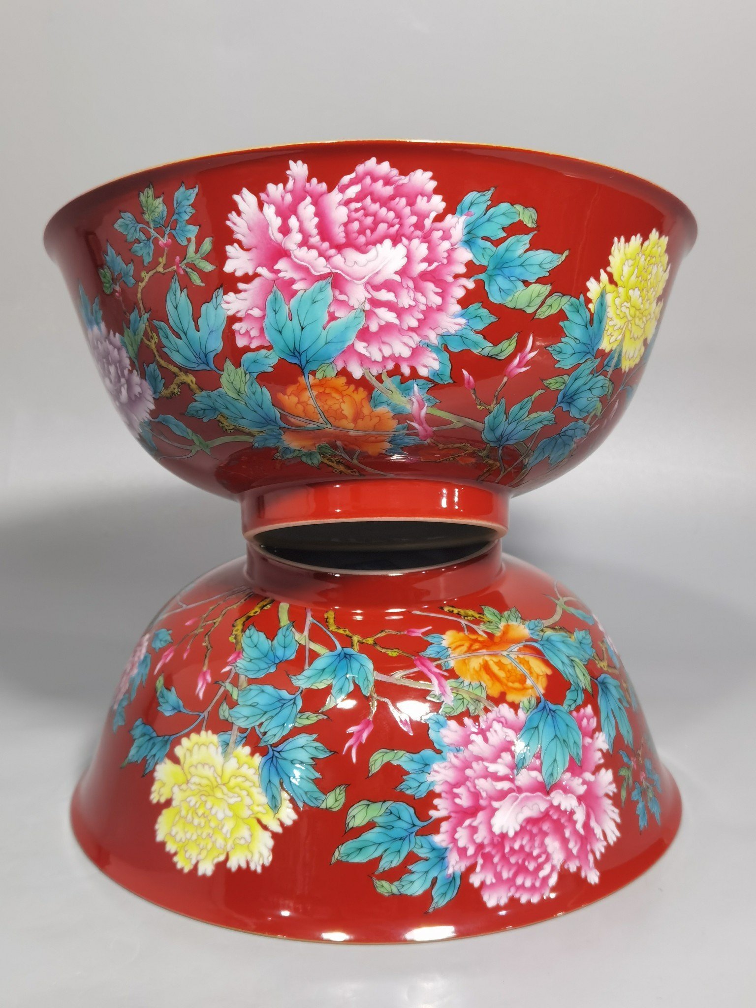 Qing Dynasty Yongzheng enamel coral red ground peony flower bowl
