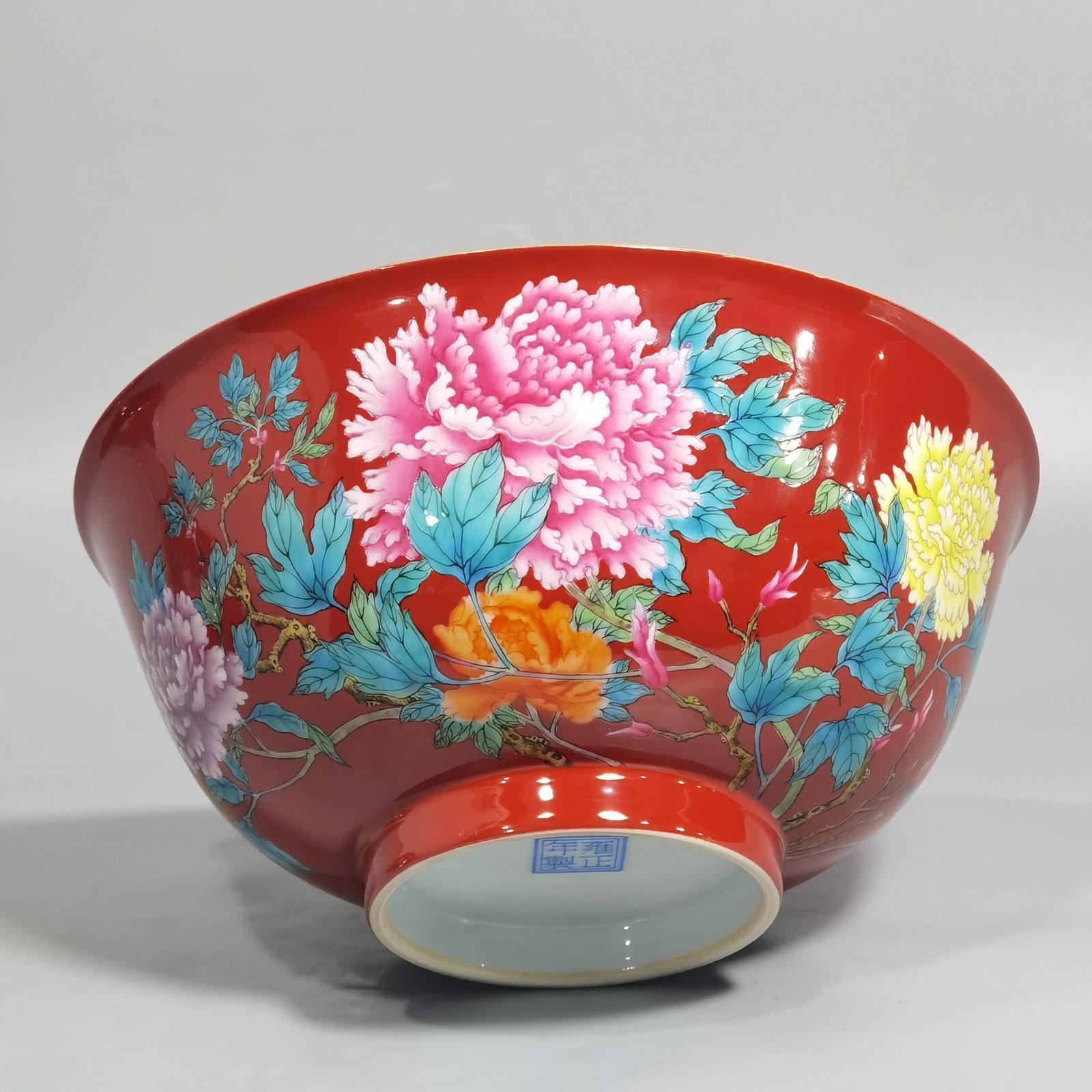 Qing Dynasty Yongzheng enamel coral red ground peony flower bowl