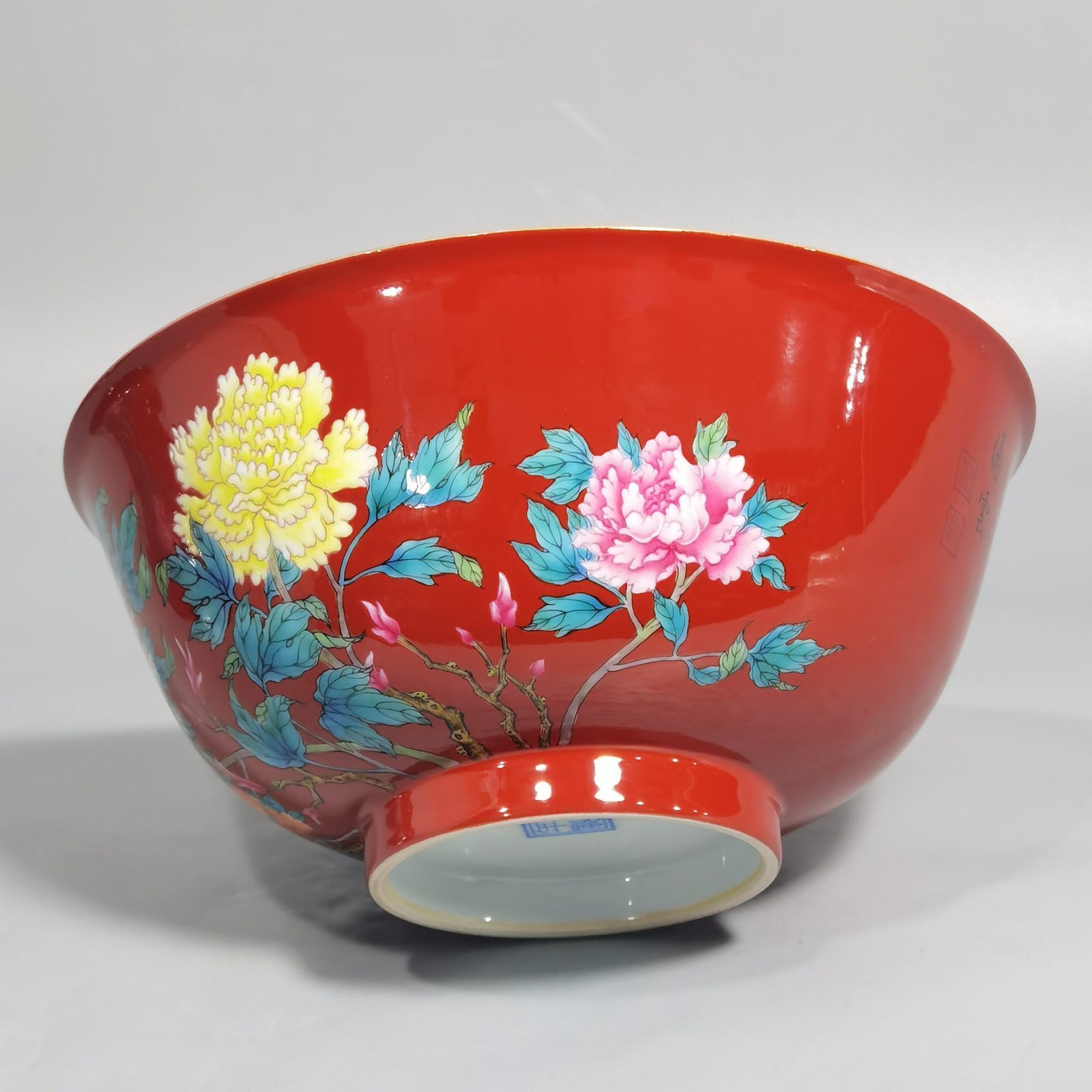 Qing Dynasty Yongzheng enamel coral red ground peony flower bowl