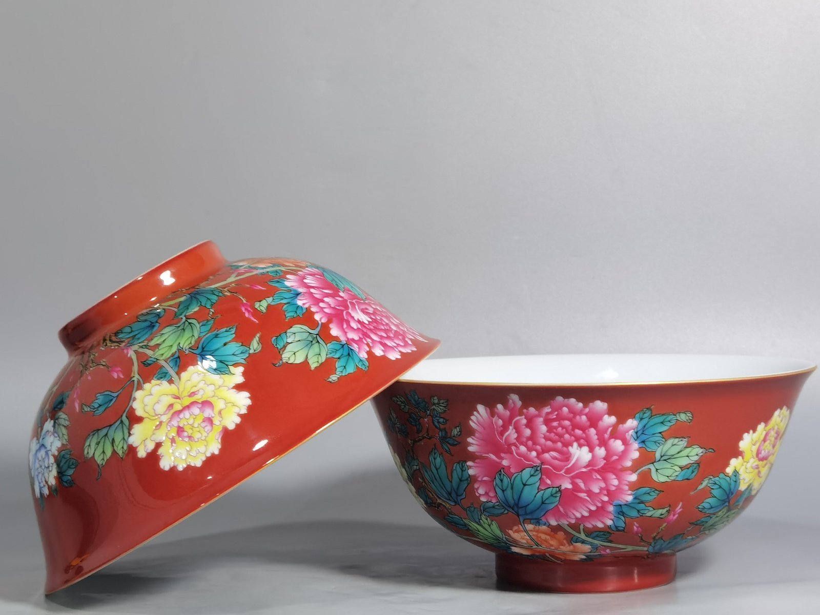 Qing Dynasty Yongzheng enamel coral red ground peony flower bowl