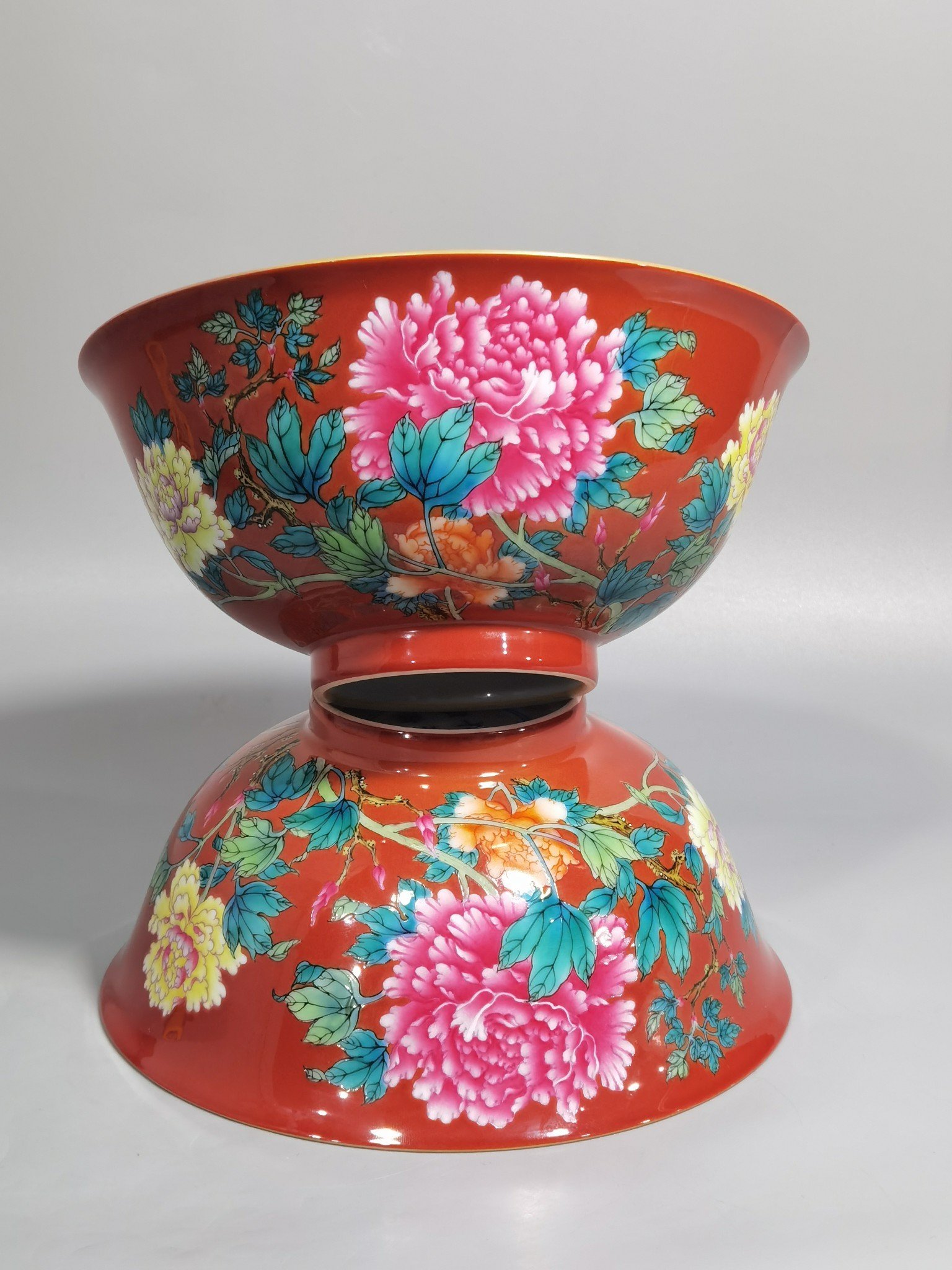 Qing Dynasty Yongzheng enamel coral red ground peony flower bowl