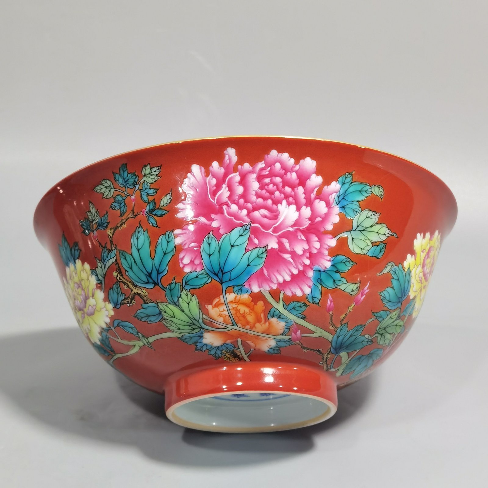 Qing Dynasty Yongzheng enamel coral red ground peony flower bowl
