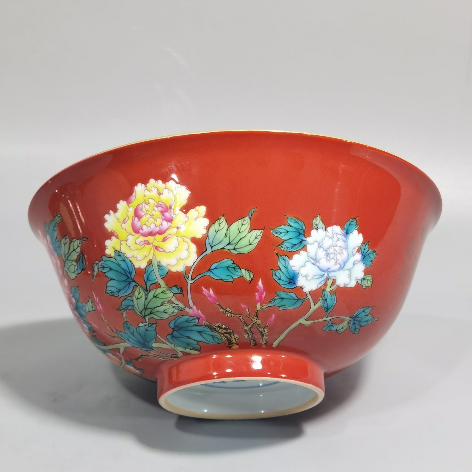 Qing Dynasty Yongzheng enamel coral red ground peony flower bowl