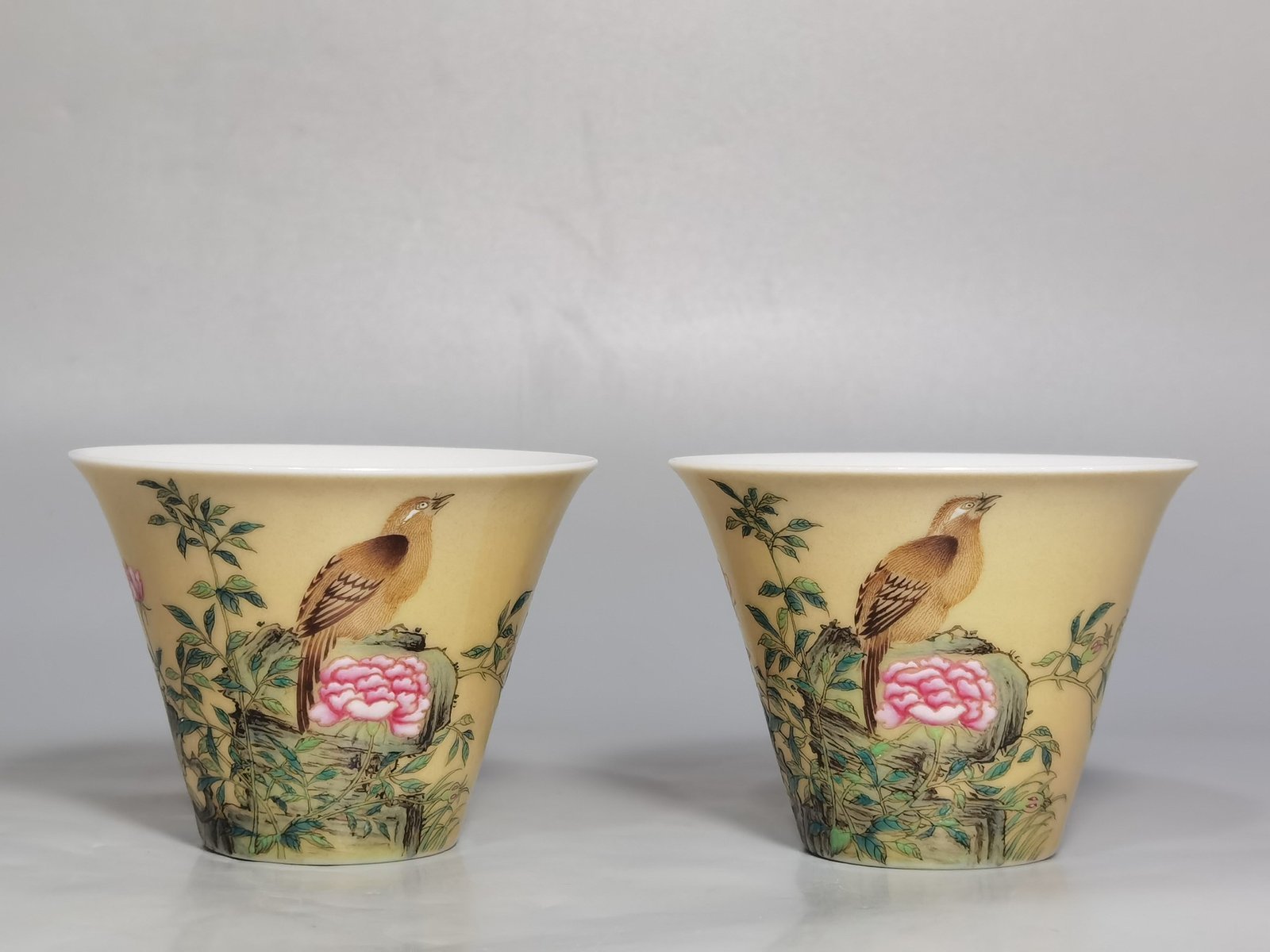 Qing Dynasty Yongzheng enamel beige glaze horseshoe cup with flower and bird pattern