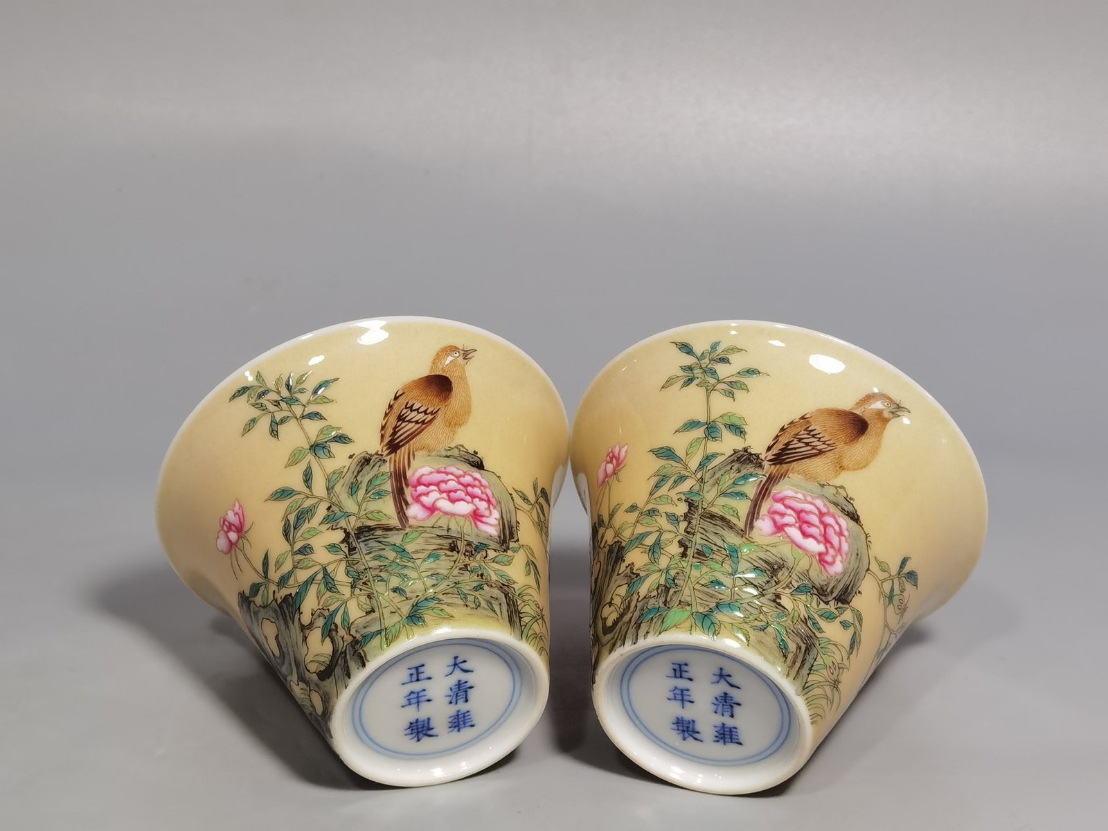 Qing Dynasty Yongzheng enamel beige glaze horseshoe cup with flower and bird pattern