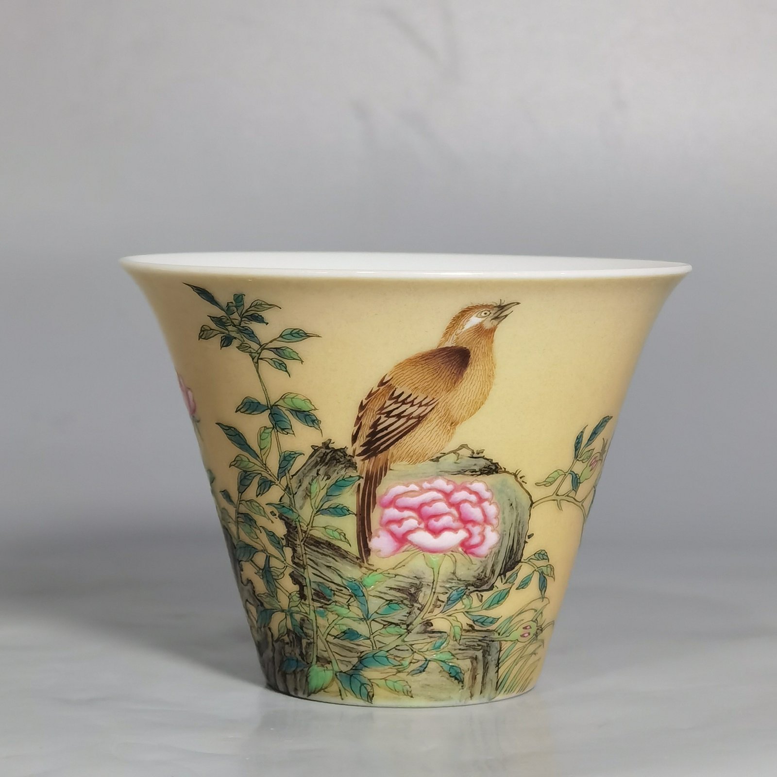 Qing Dynasty Yongzheng enamel beige glaze horseshoe cup with flower and bird pattern