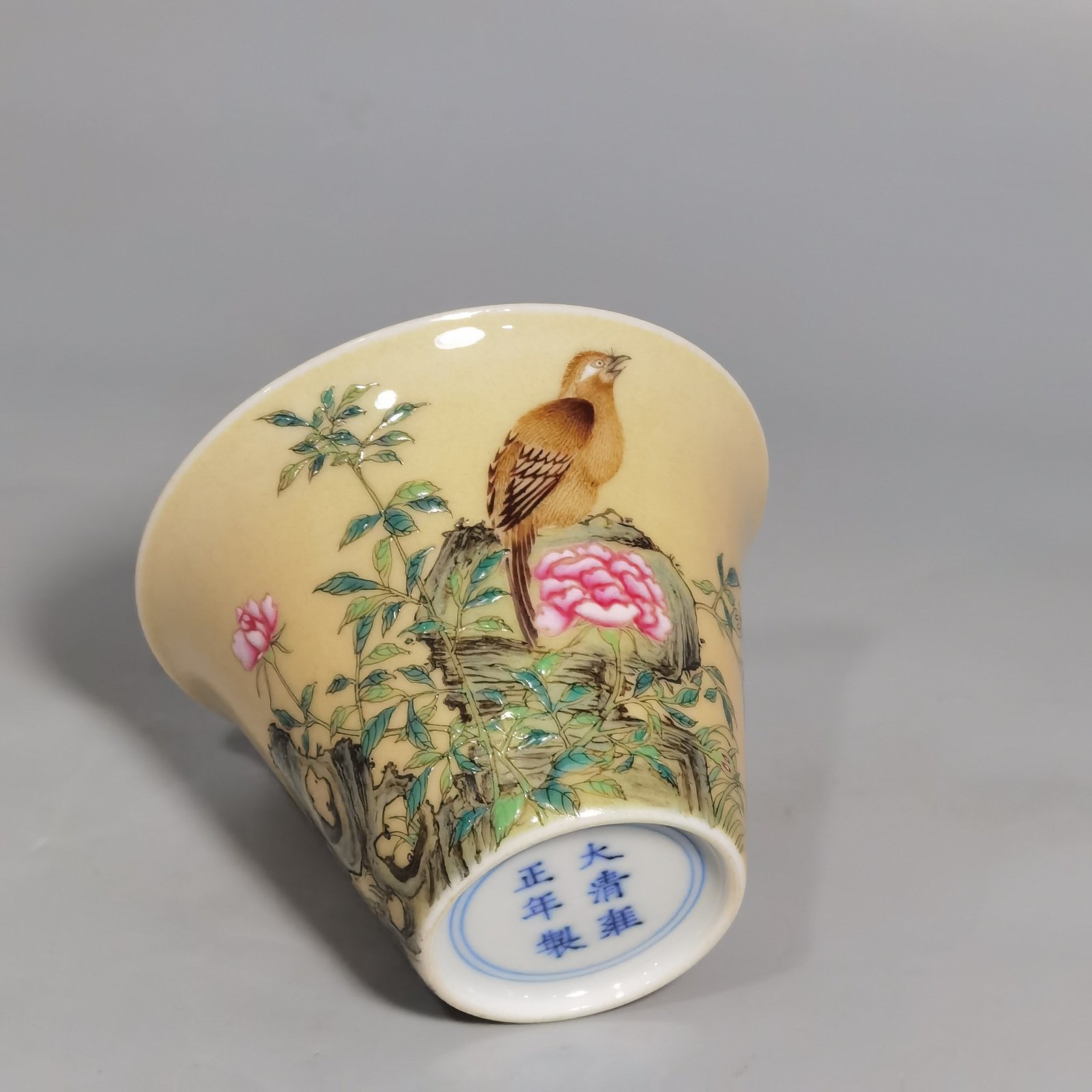 Qing Dynasty Yongzheng enamel beige glaze horseshoe cup with flower and bird pattern
