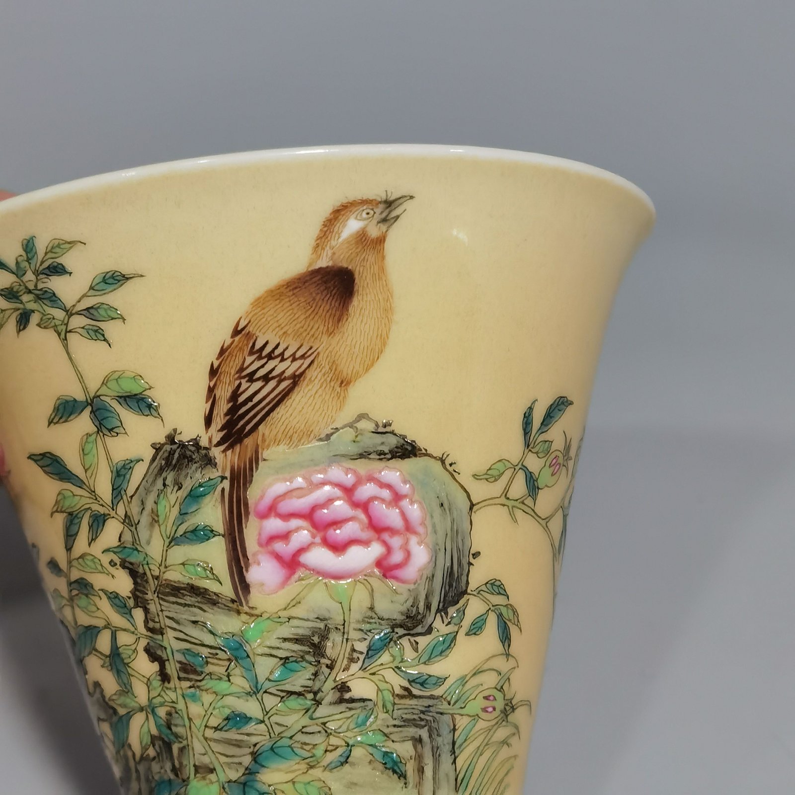 Qing Dynasty Yongzheng enamel beige glaze horseshoe cup with flower and bird pattern