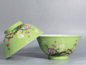 Qing Dynasty Yongzheng Enamel green ground bamboo and plum double clear bowl