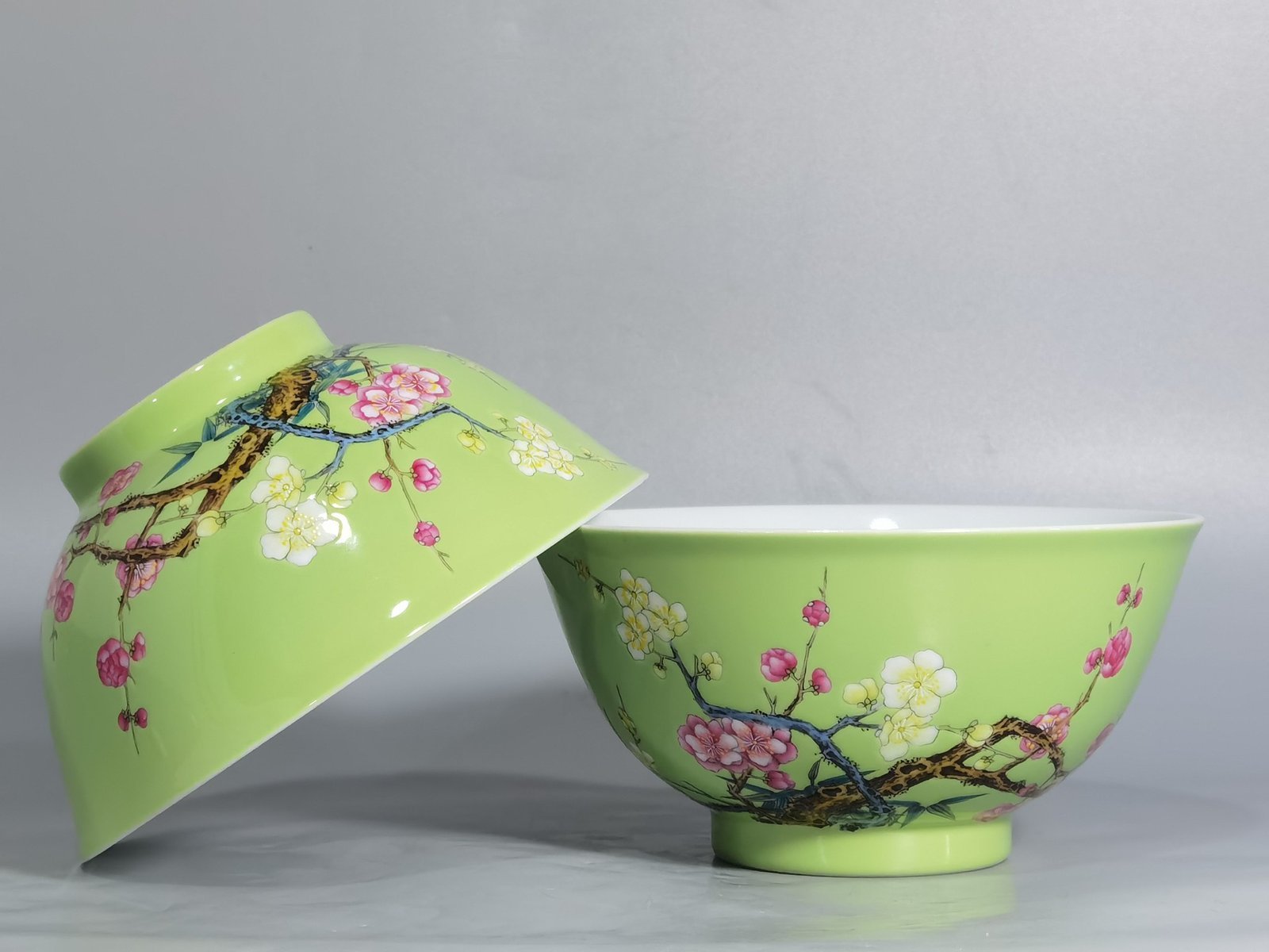 Qing Dynasty Yongzheng Enamel green ground bamboo and plum double clear bowl