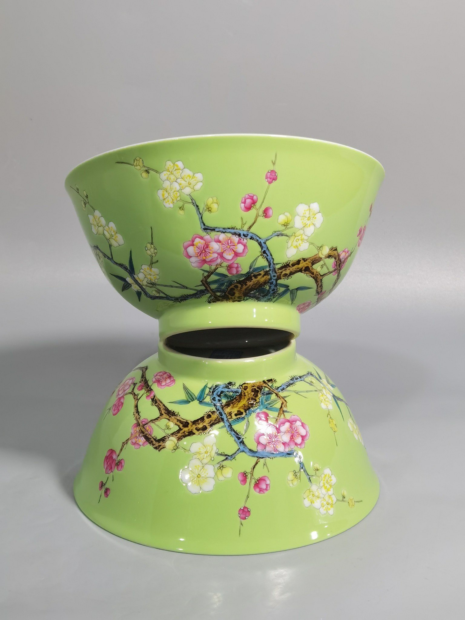 Qing Dynasty Yongzheng Enamel green ground bamboo and plum double clear bowl