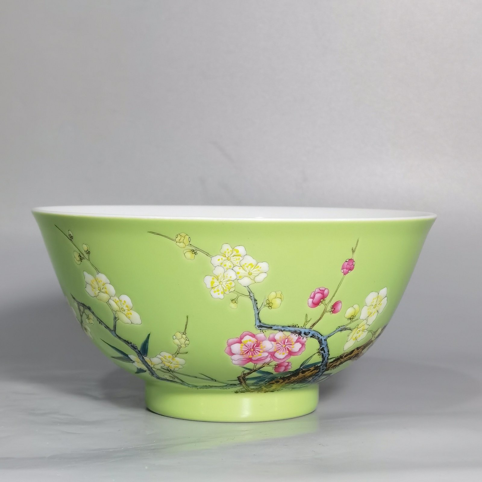 Qing Dynasty Yongzheng Enamel green ground bamboo and plum double clear bowl