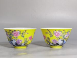 Qing Dynasty Yongzheng a pair of enamel yellow ground peony flower cups