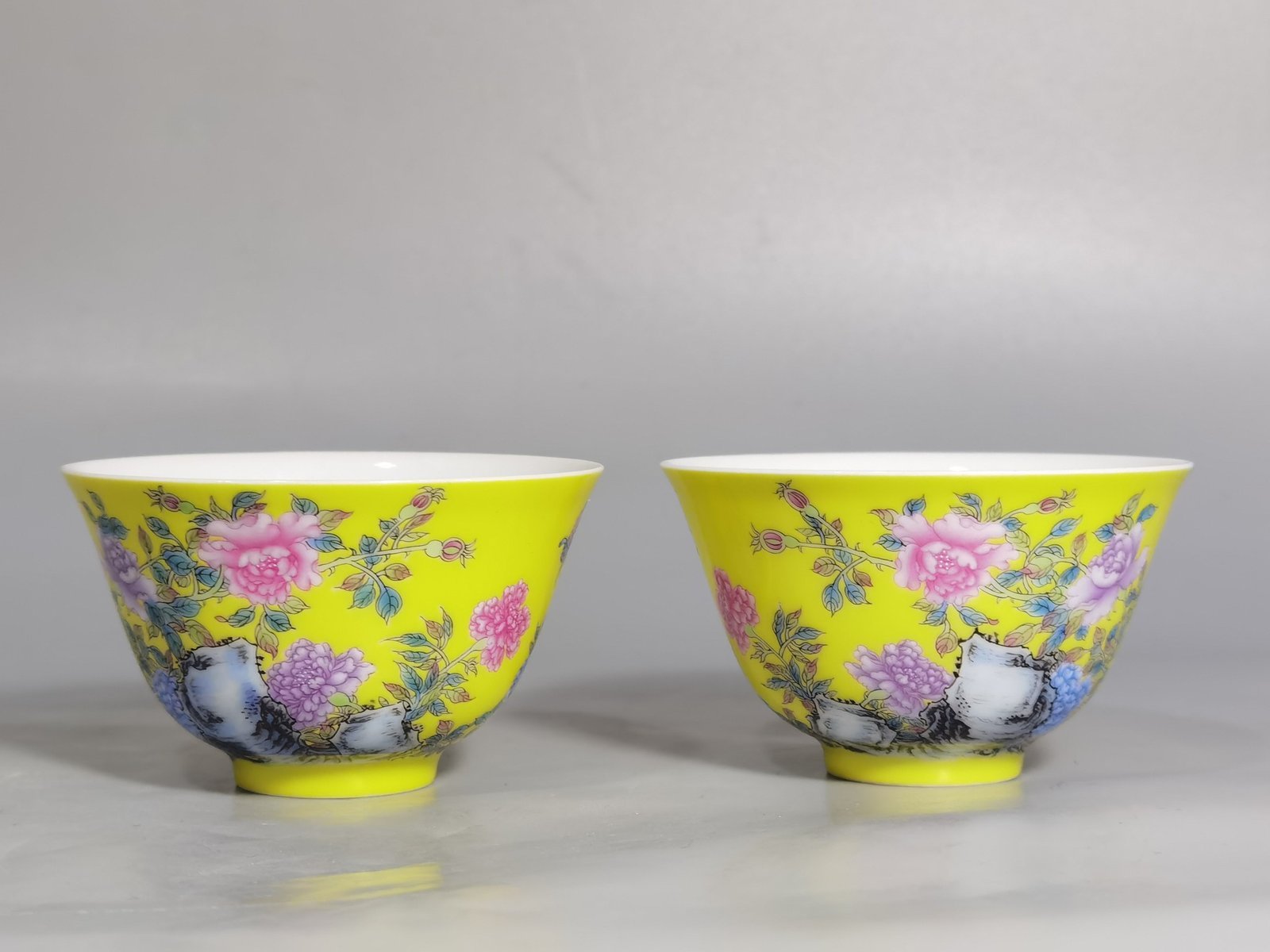 Qing Dynasty Yongzheng a pair of enamel yellow ground peony flower cups