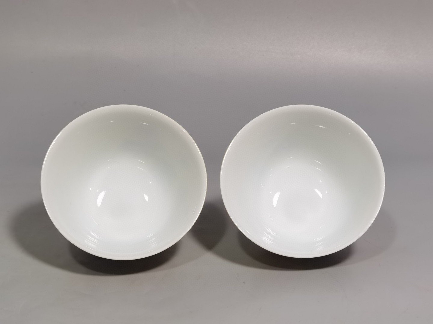 Qing Dynasty Yongzheng a pair of enamel yellow ground peony flower cups