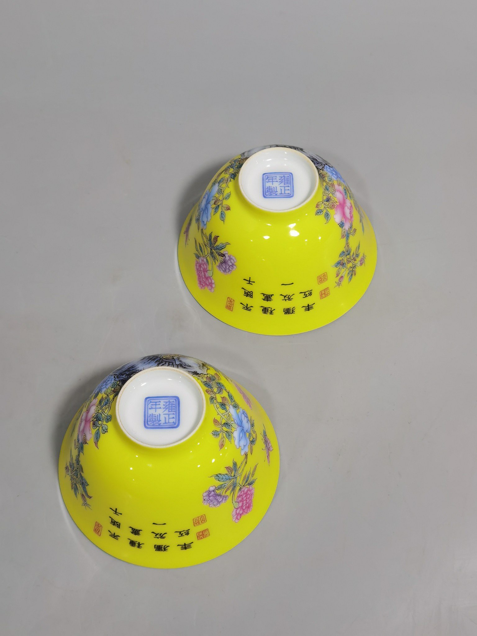 Qing Dynasty Yongzheng a pair of enamel yellow ground peony flower cups