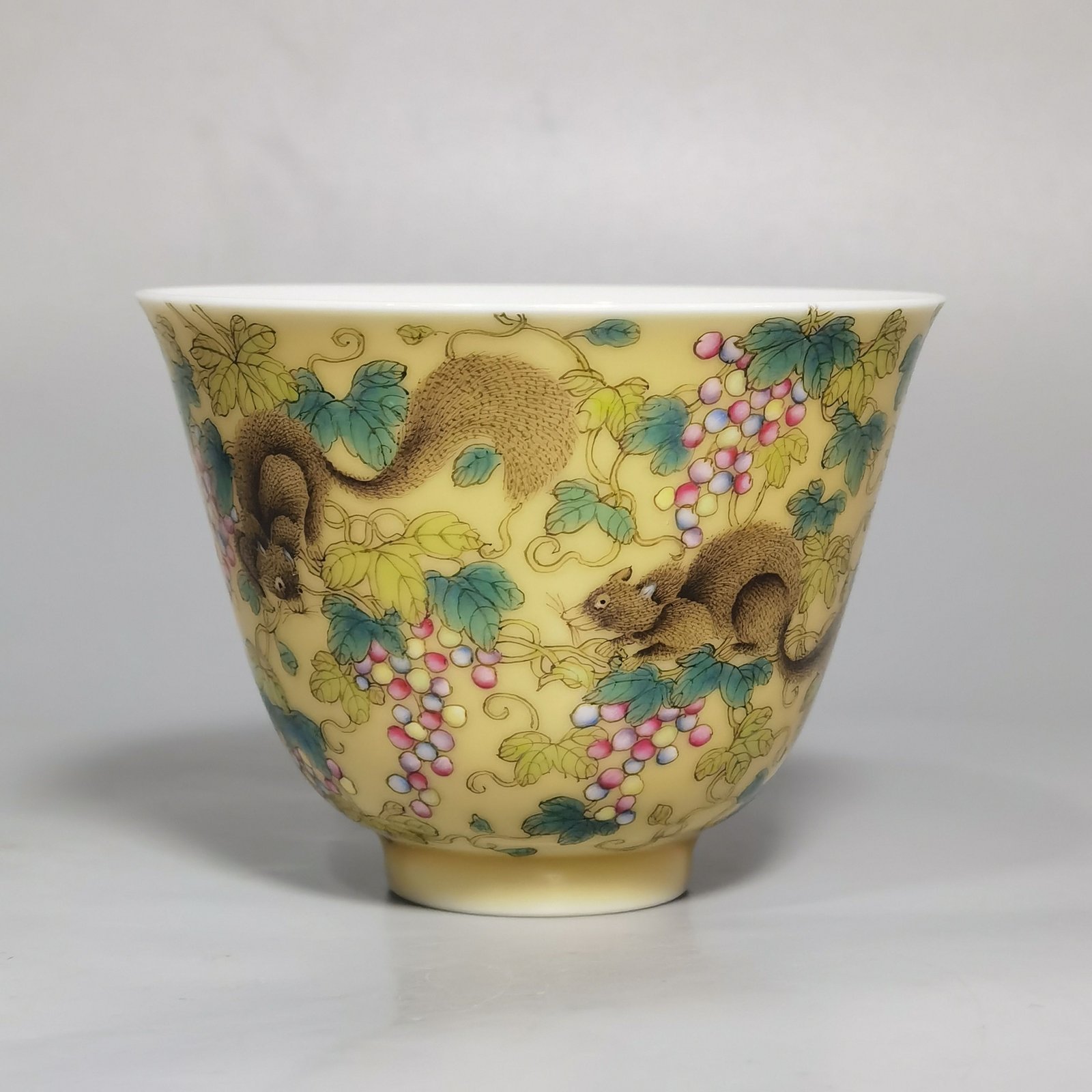 Qing Dynasty Yongzheng A pair of beige-glazed pastel squirrel-grape cups