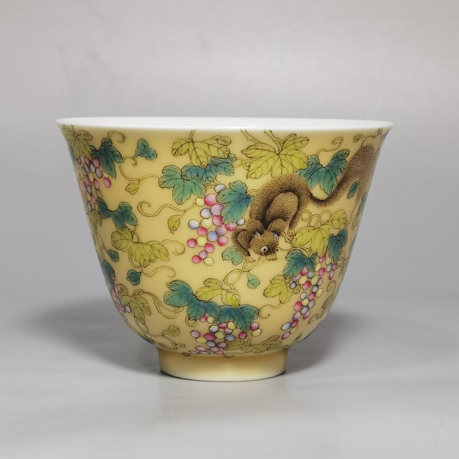 Qing Dynasty Yongzheng A pair of beige-glazed pastel squirrel-grape cups