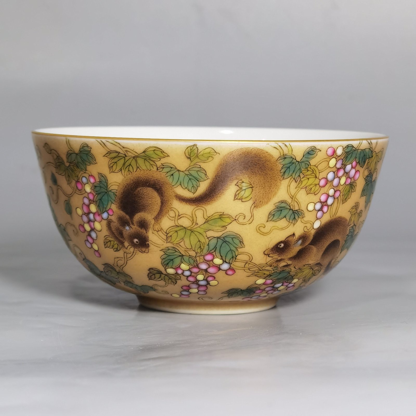 Qing Dynasty Yongzheng A pair of beige-glazed pastel squirrel-grape cups