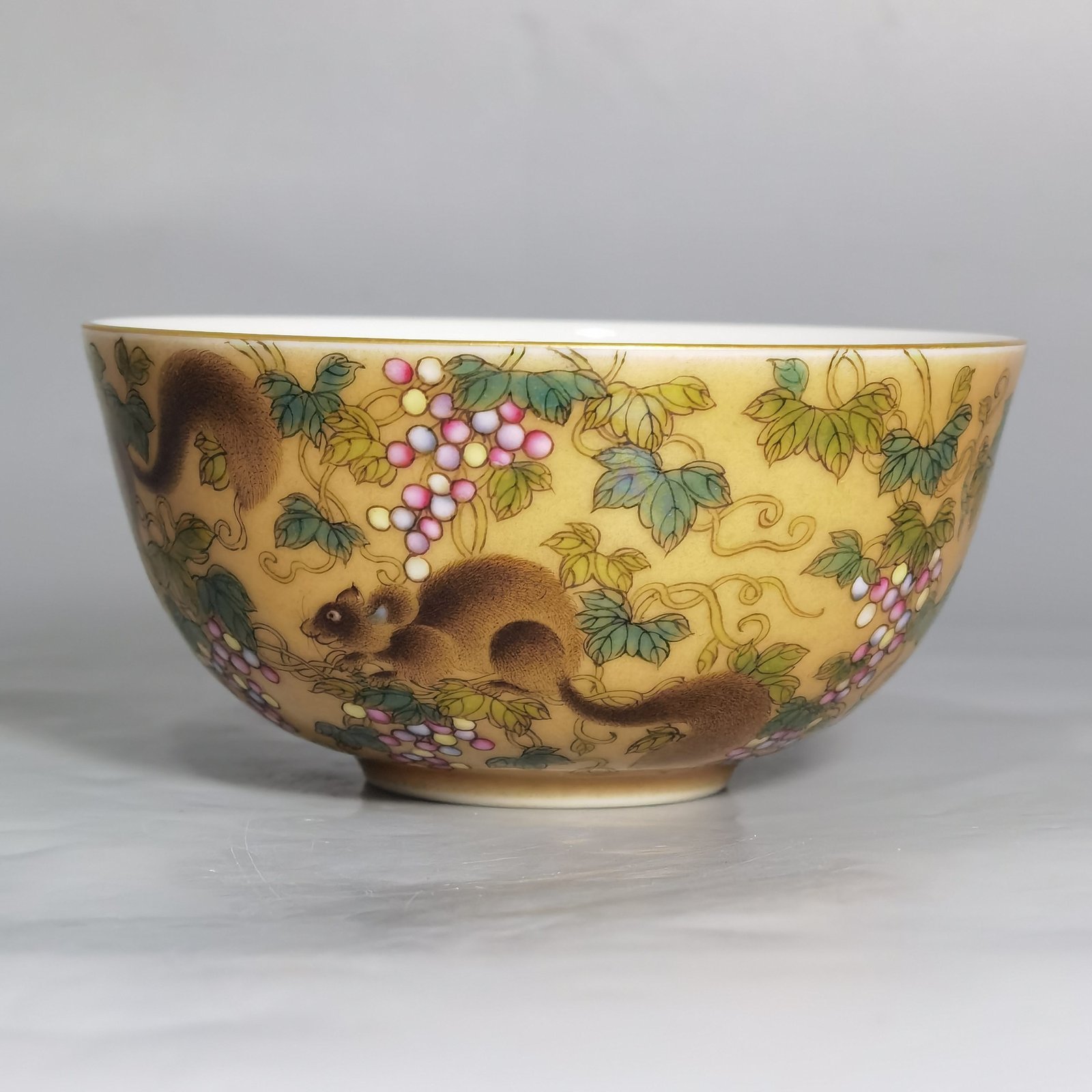 Qing Dynasty Yongzheng A pair of beige-glazed pastel squirrel-grape cups