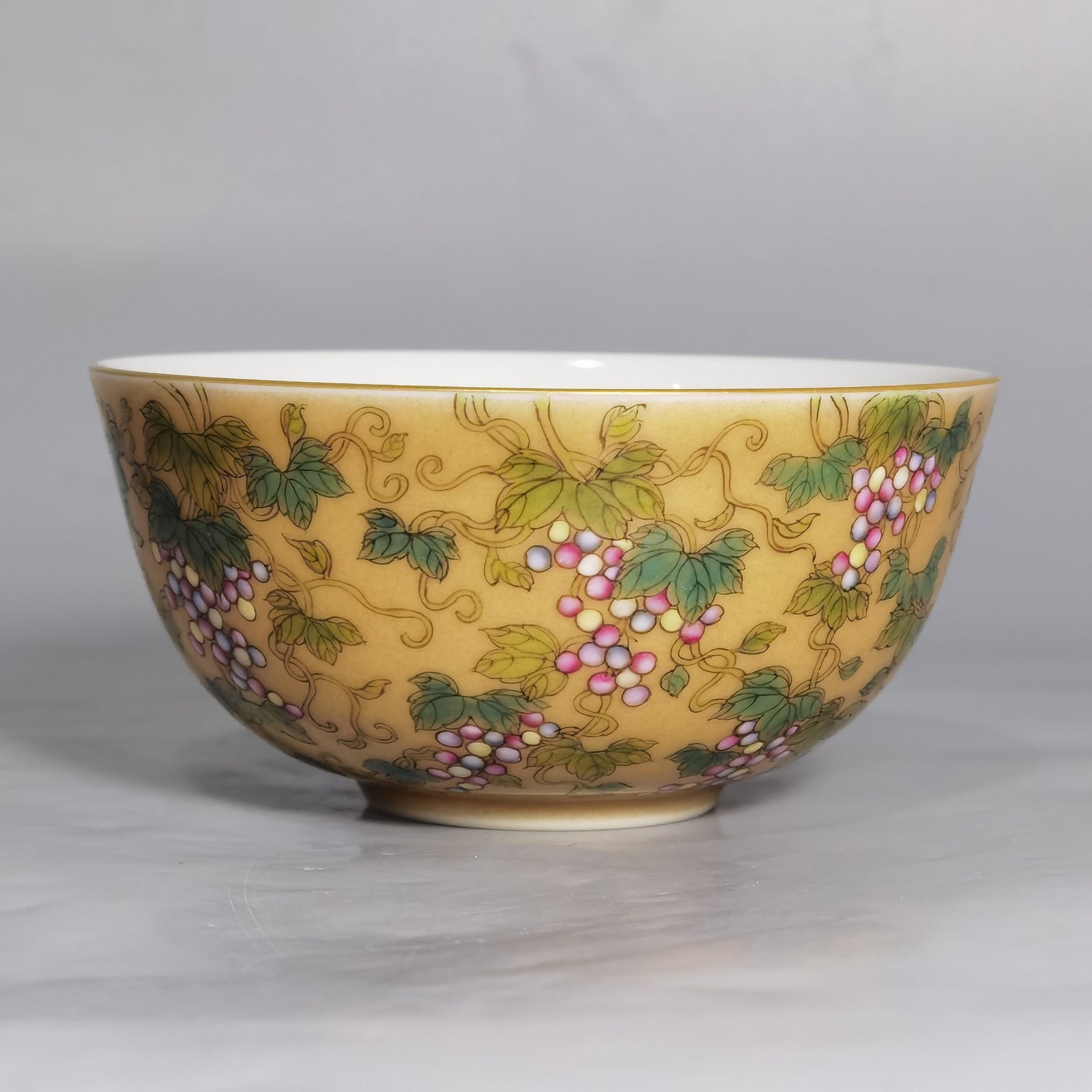 Qing Dynasty Yongzheng A pair of beige-glazed pastel squirrel-grape cups