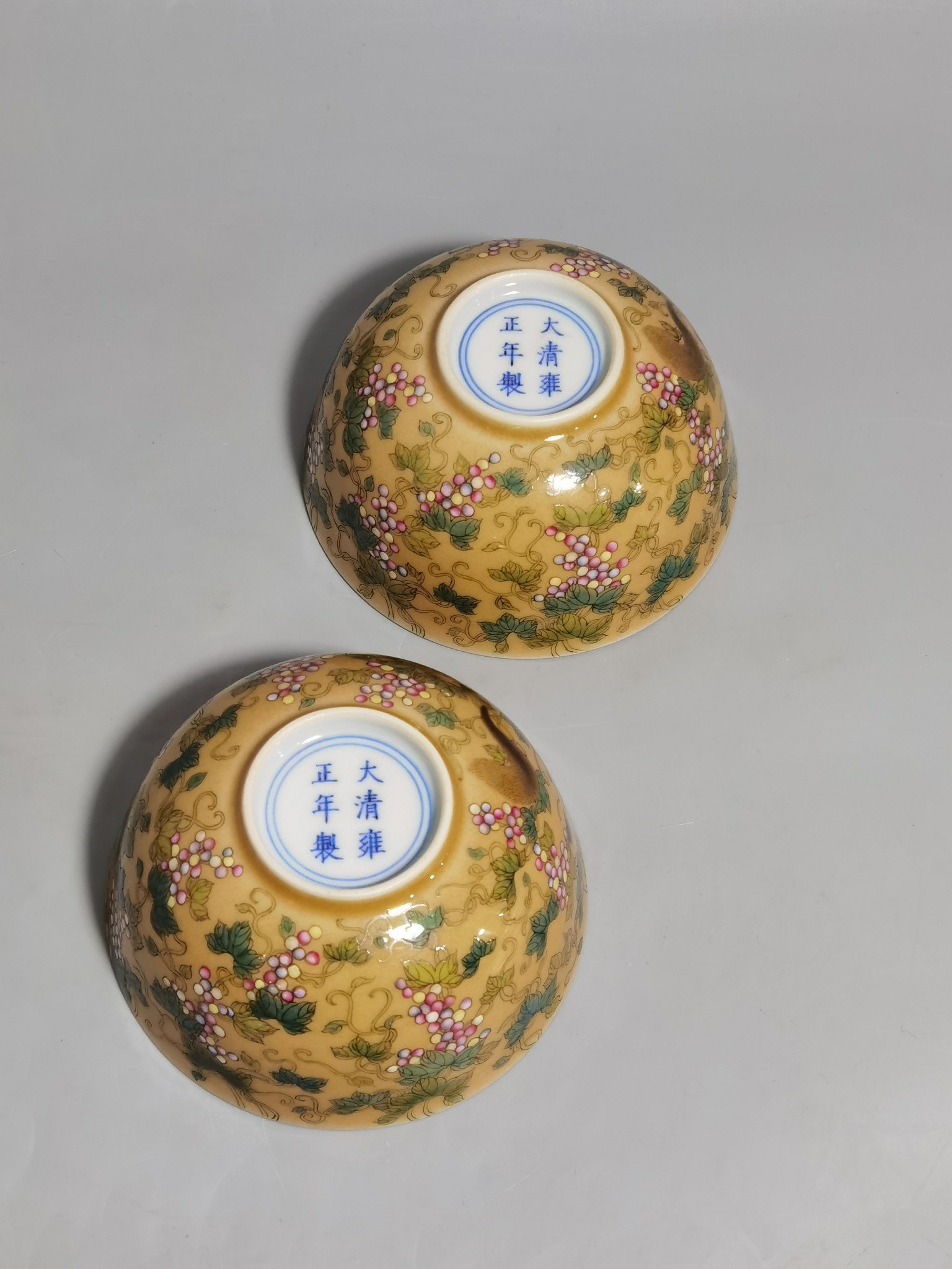 Qing Dynasty Yongzheng A pair of beige-glazed pastel squirrel-grape cups