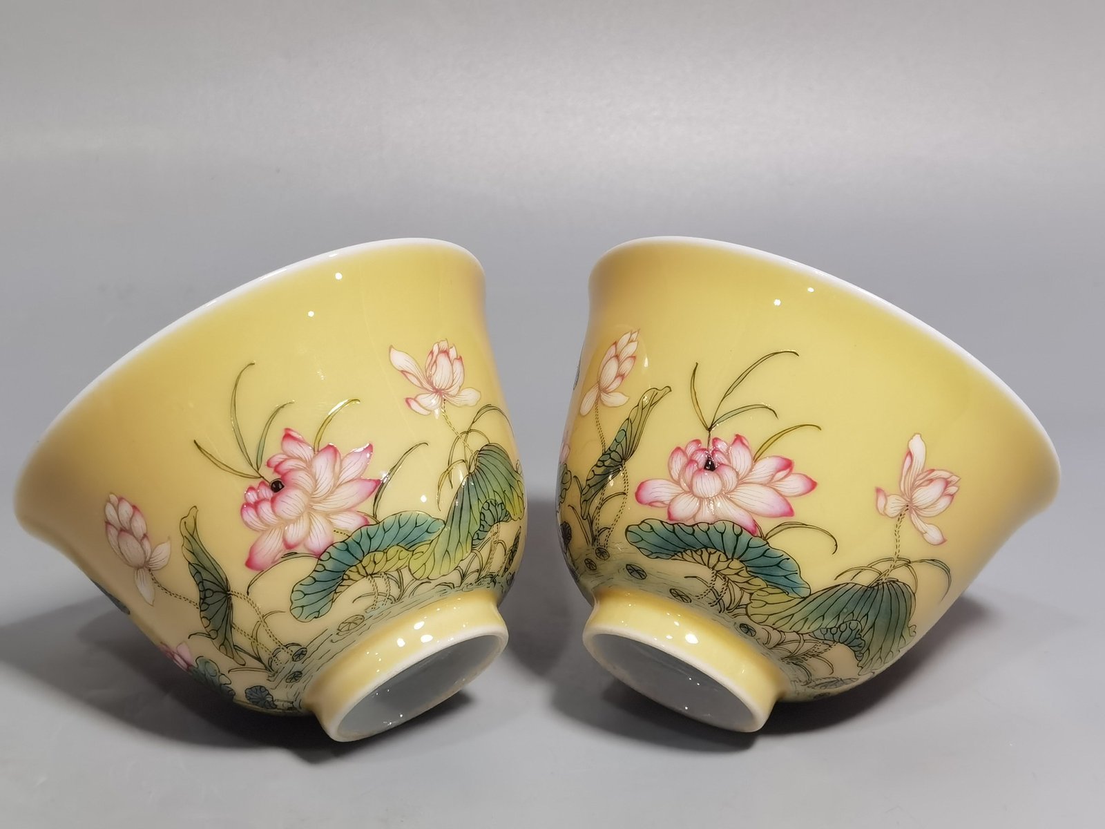 Qing Dynasty Yongzheng A pair of beige-glazed pastel mandarin duck and lotus cups