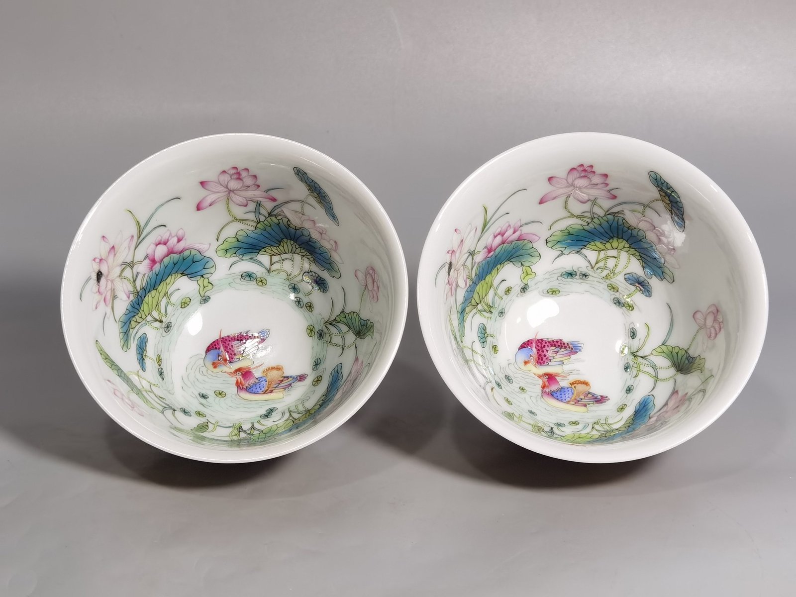 Qing Dynasty Yongzheng A pair of beige-glazed pastel mandarin duck and lotus cups