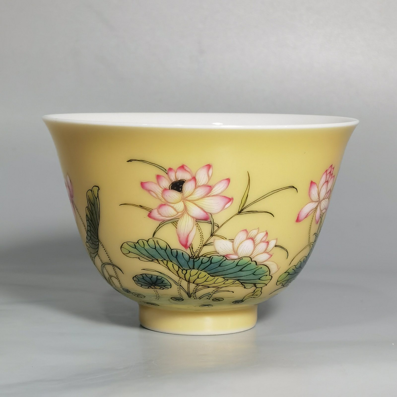 Qing Dynasty Yongzheng A pair of beige-glazed pastel mandarin duck and lotus cups