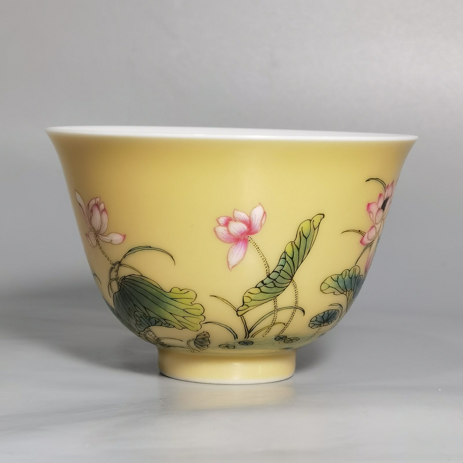 Qing Dynasty Yongzheng A pair of beige-glazed pastel mandarin duck and lotus cups