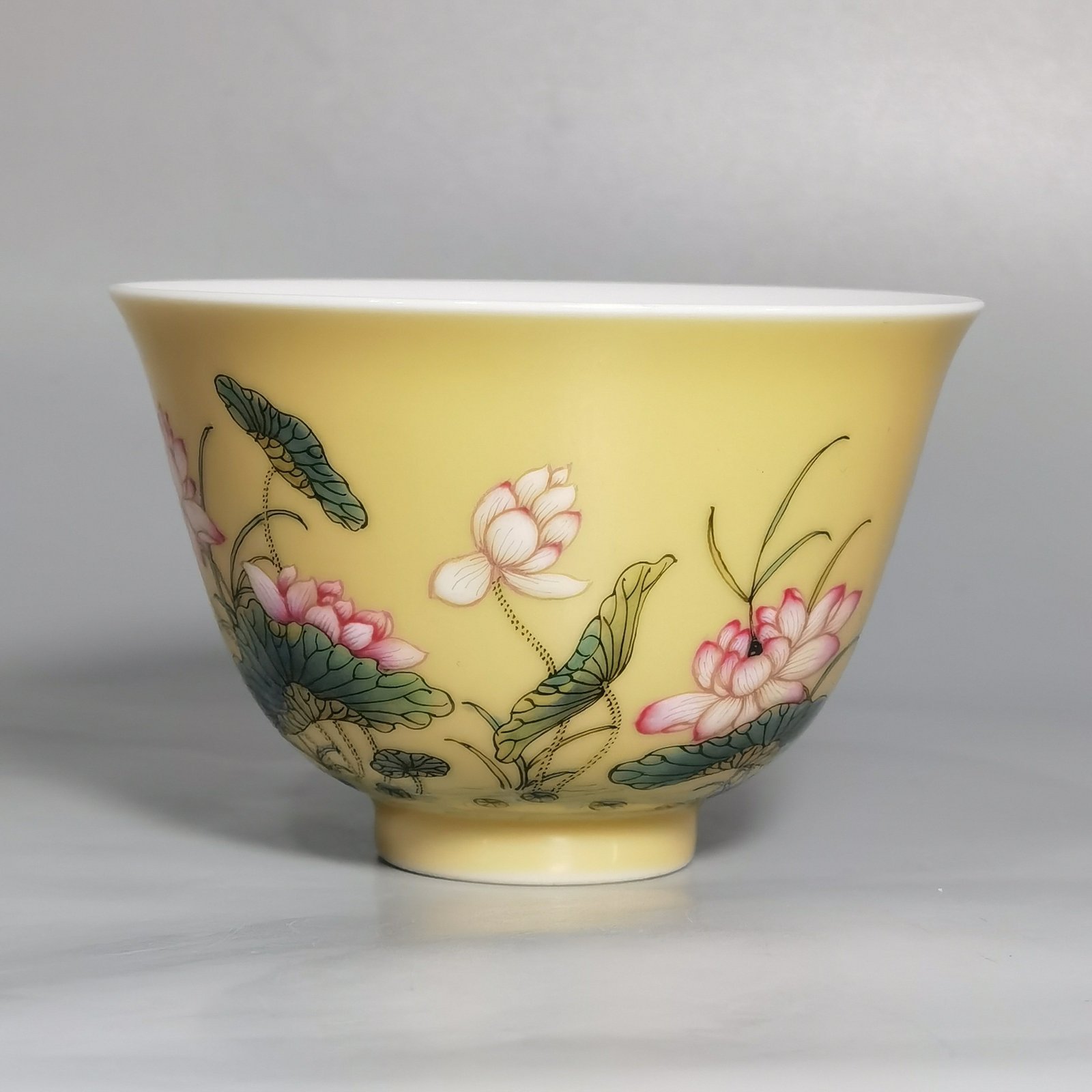 Qing Dynasty Yongzheng A pair of beige-glazed pastel mandarin duck and lotus cups