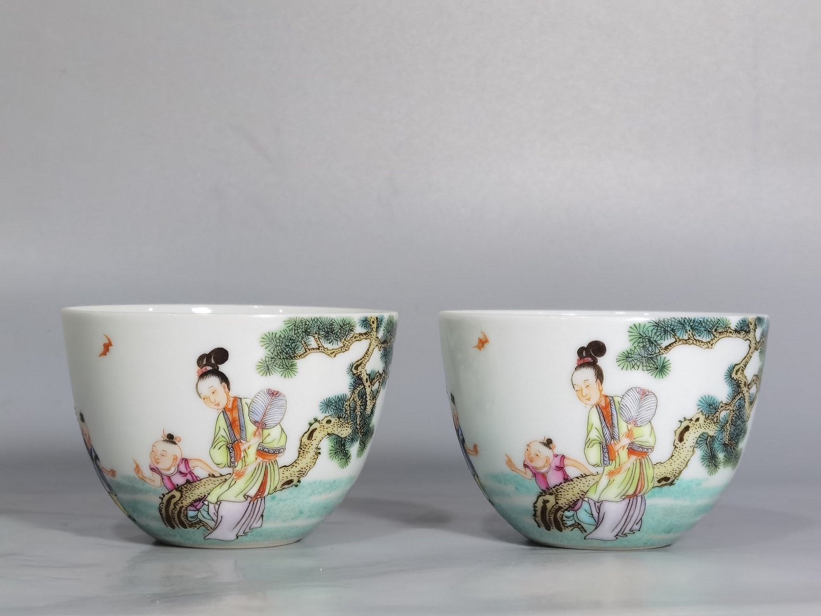 Qing Dynasty Yongzheng A pair of pastel Sanniang godson cups