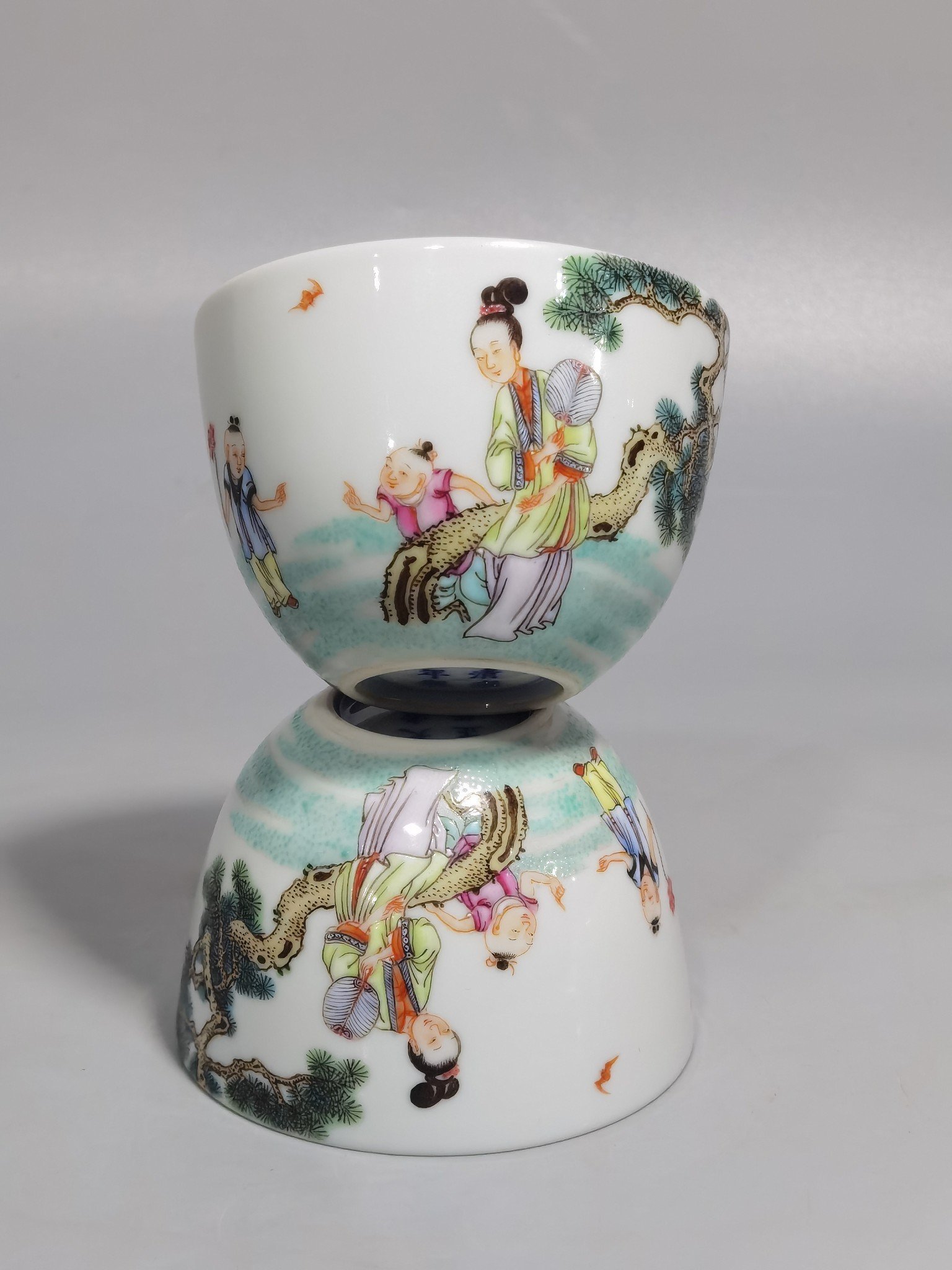 Qing Dynasty Yongzheng A pair of pastel Sanniang godson cups