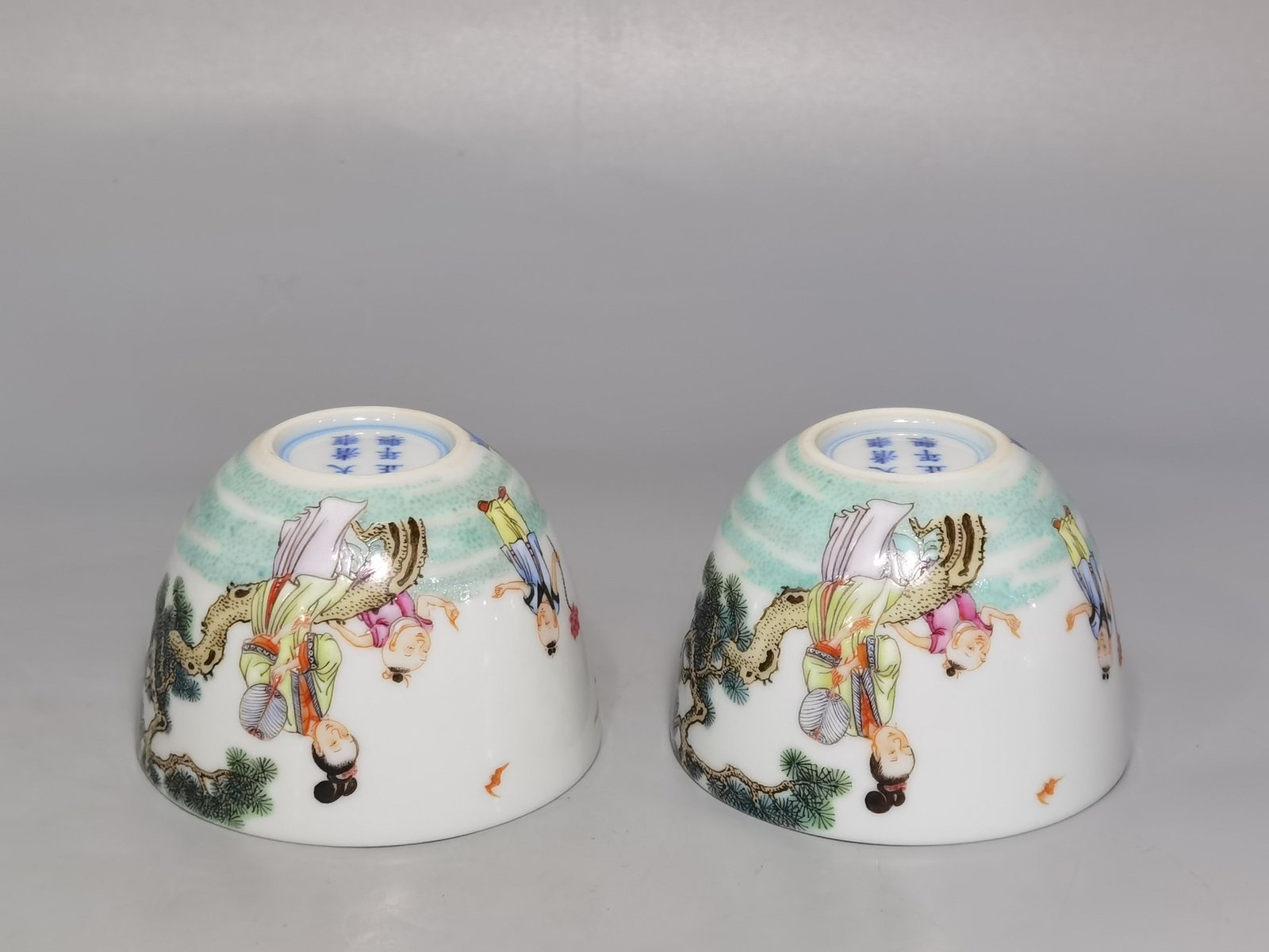 Qing Dynasty Yongzheng A pair of pastel Sanniang godson cups