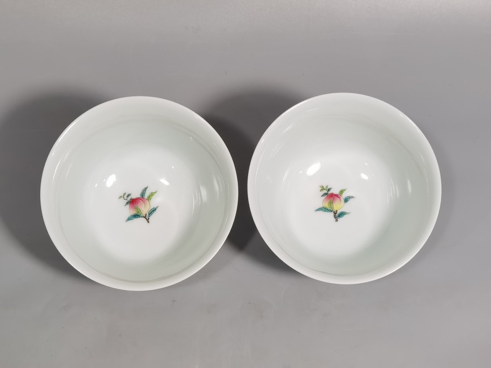 Qing Dynasty Yongzheng famille rose peach horseshoe cup with figures and stories