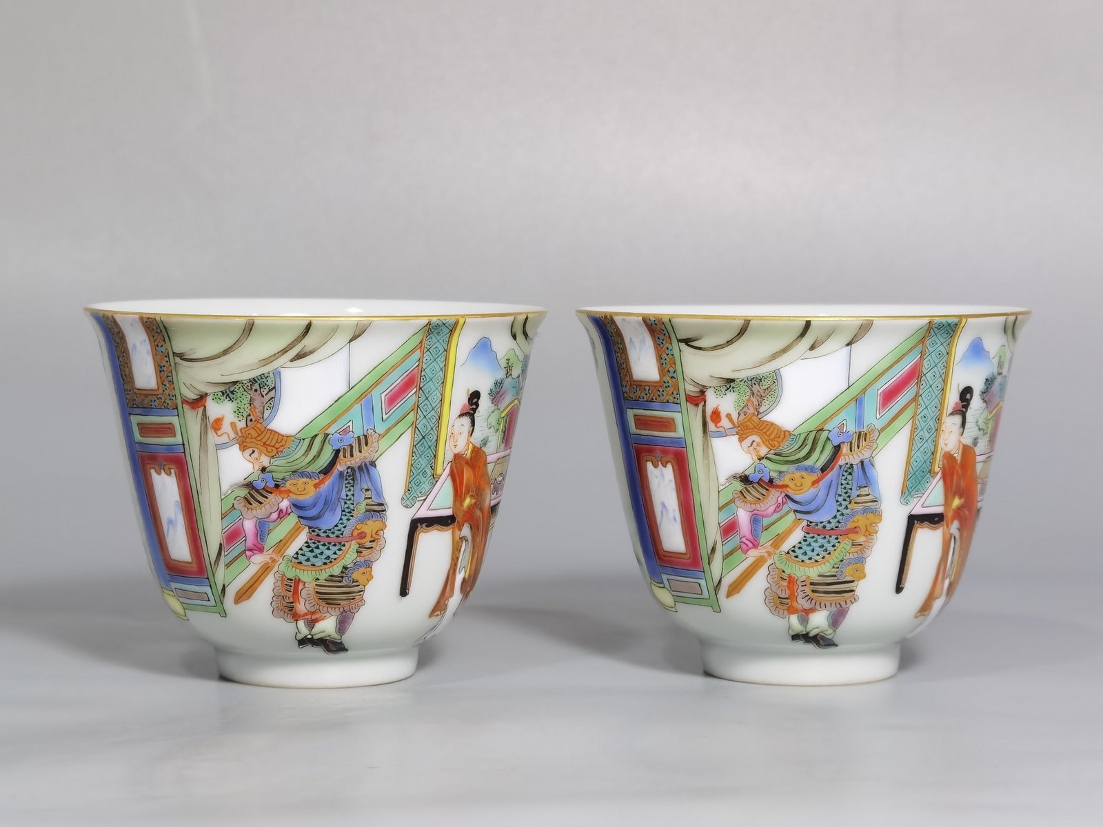 Qing Dynasty Yongzheng a pair of pastel painted Golden King Farewell mugs