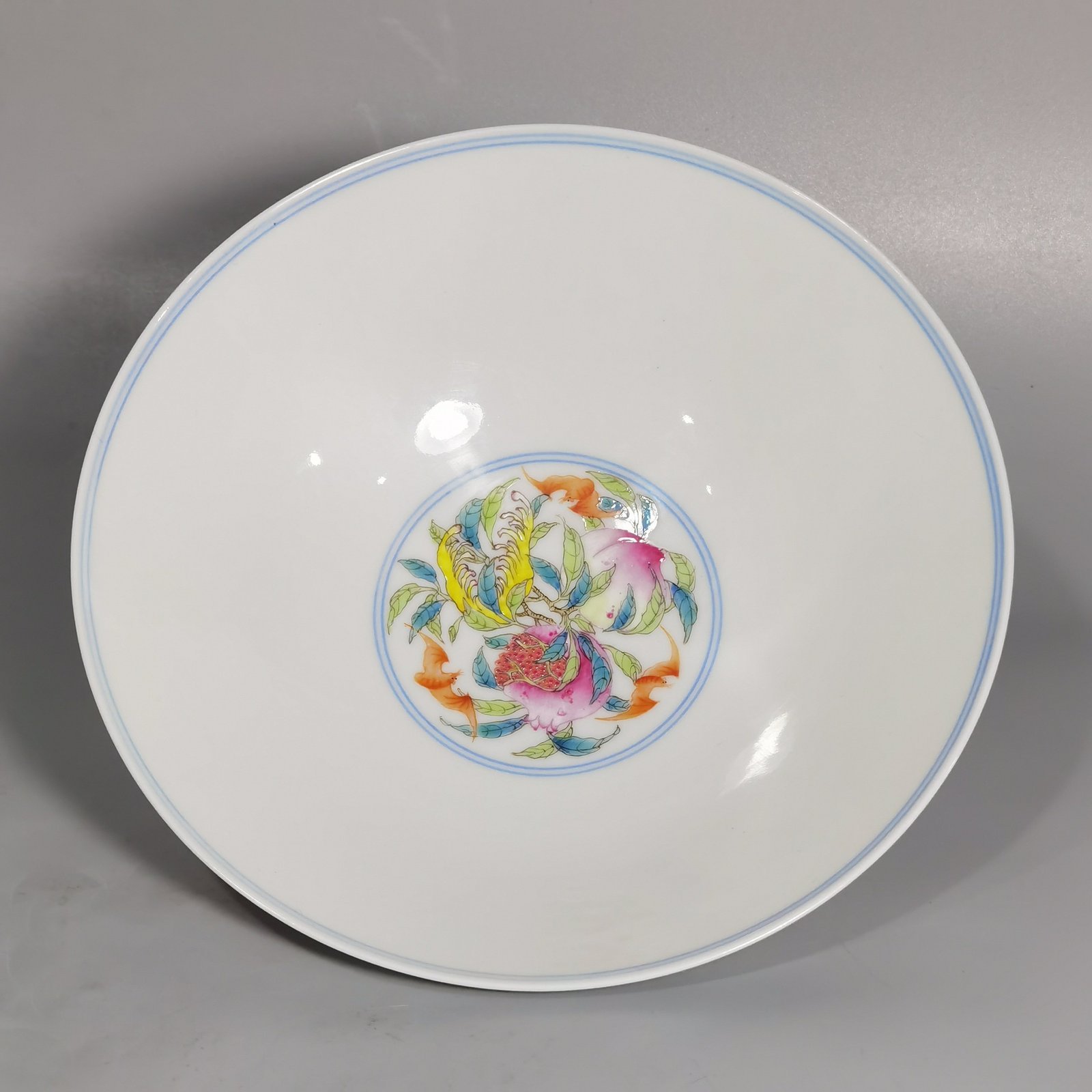Qing Dynasty Yongzheng a famille rose flower-and-bird hat bowl with three fruits inside