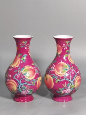 Qing Dynasty Yongzheng A pair of rouge ground pastel eight peach and five blessing vases during
