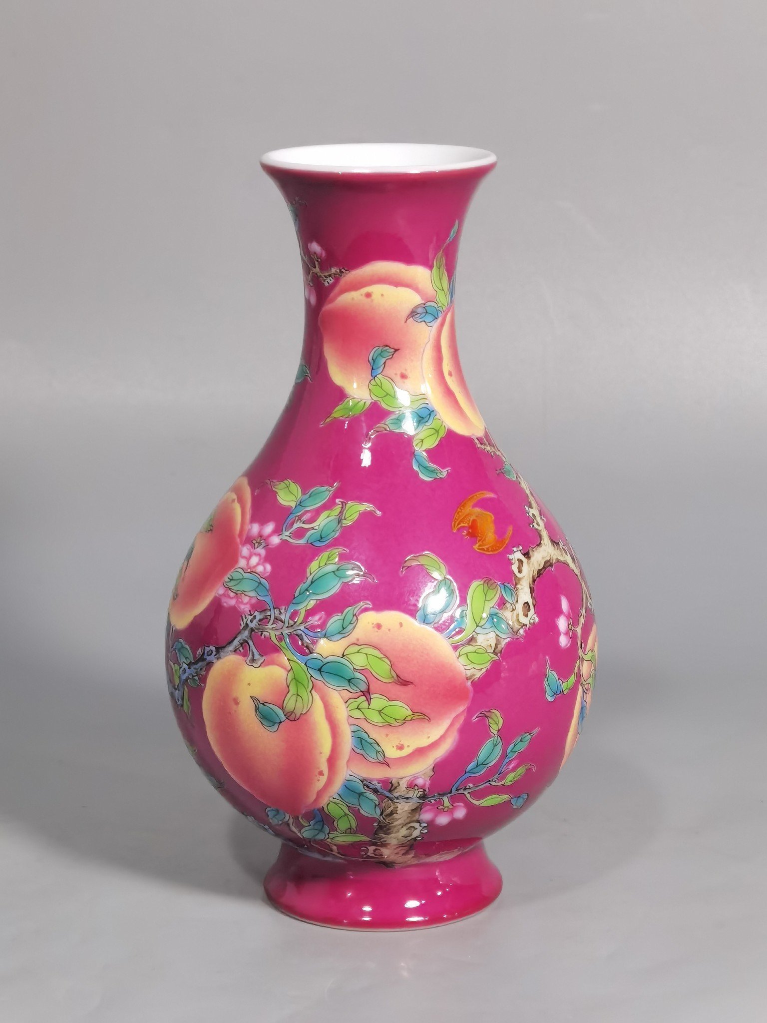 Qing Dynasty Yongzheng A pair of rouge ground pastel eight peach and five blessing vases during