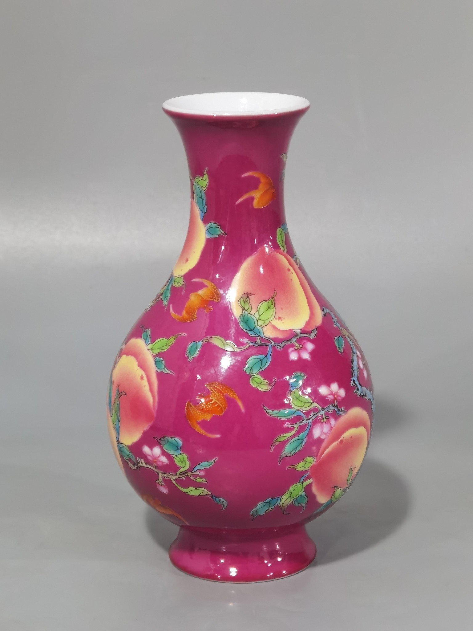 Qing Dynasty Yongzheng A pair of rouge ground pastel eight peach and five blessing vases during