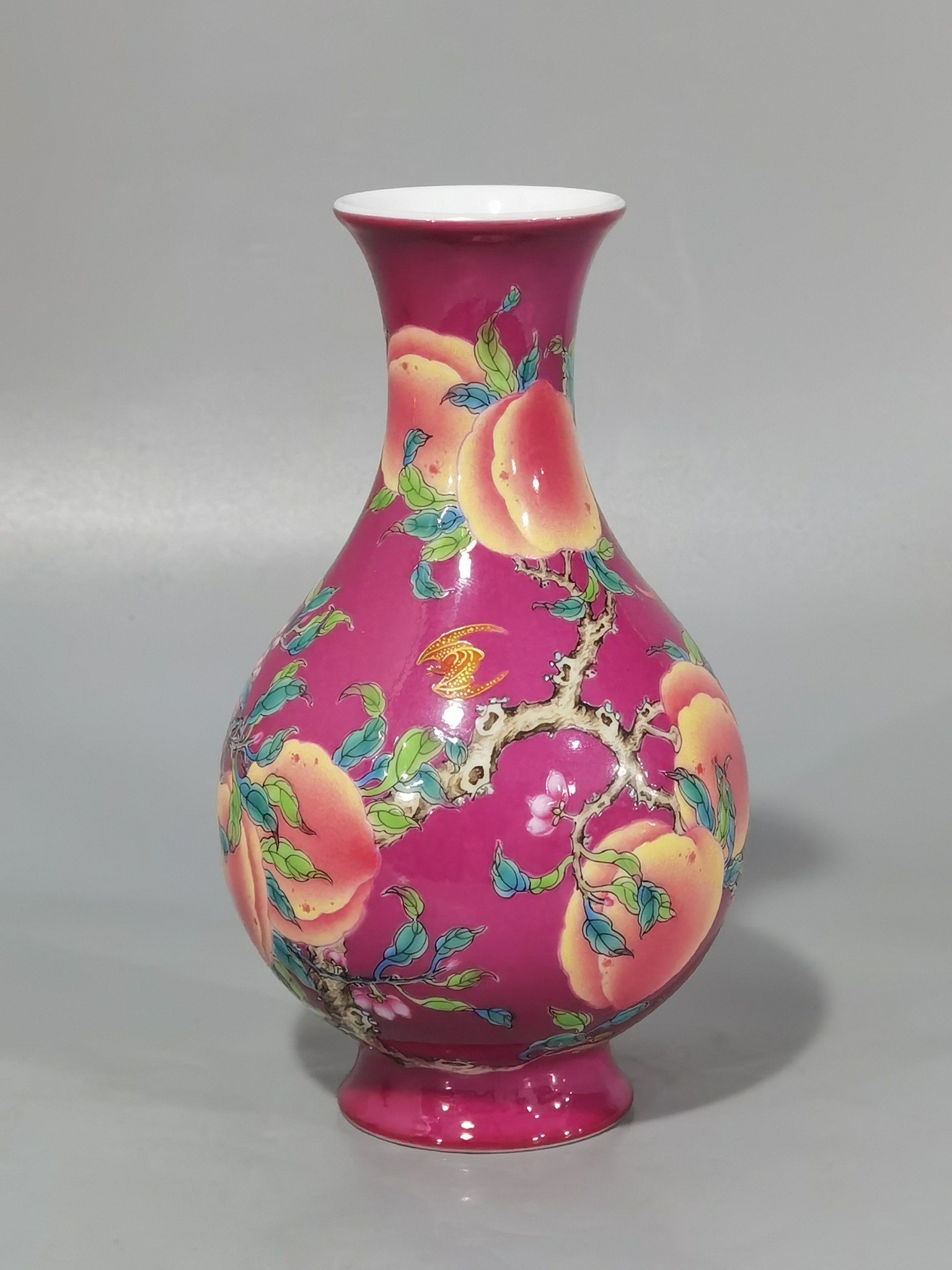 Qing Dynasty Yongzheng A pair of rouge ground pastel eight peach and five blessing vases during