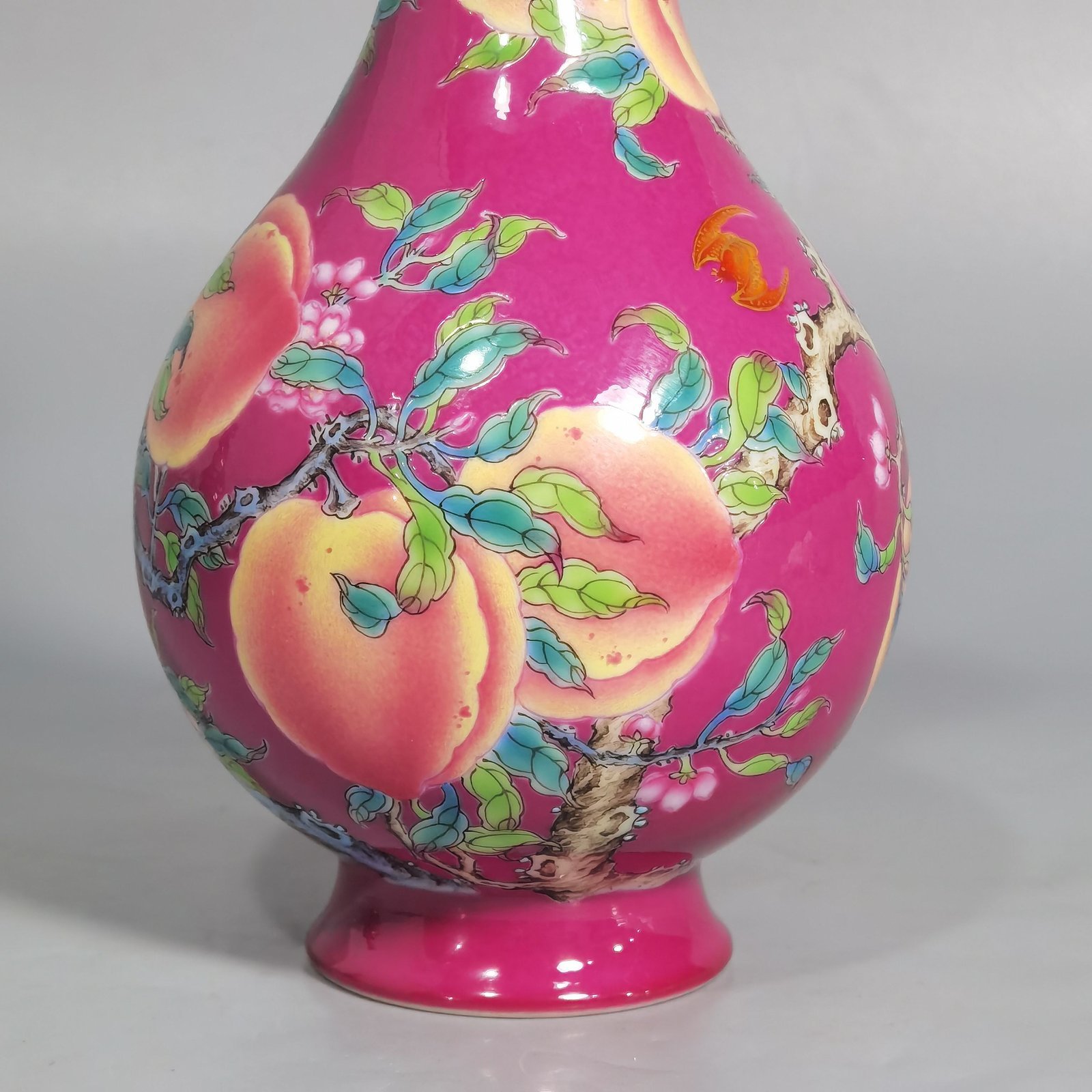 Qing Dynasty Yongzheng A pair of rouge ground pastel eight peach and five blessing vases during